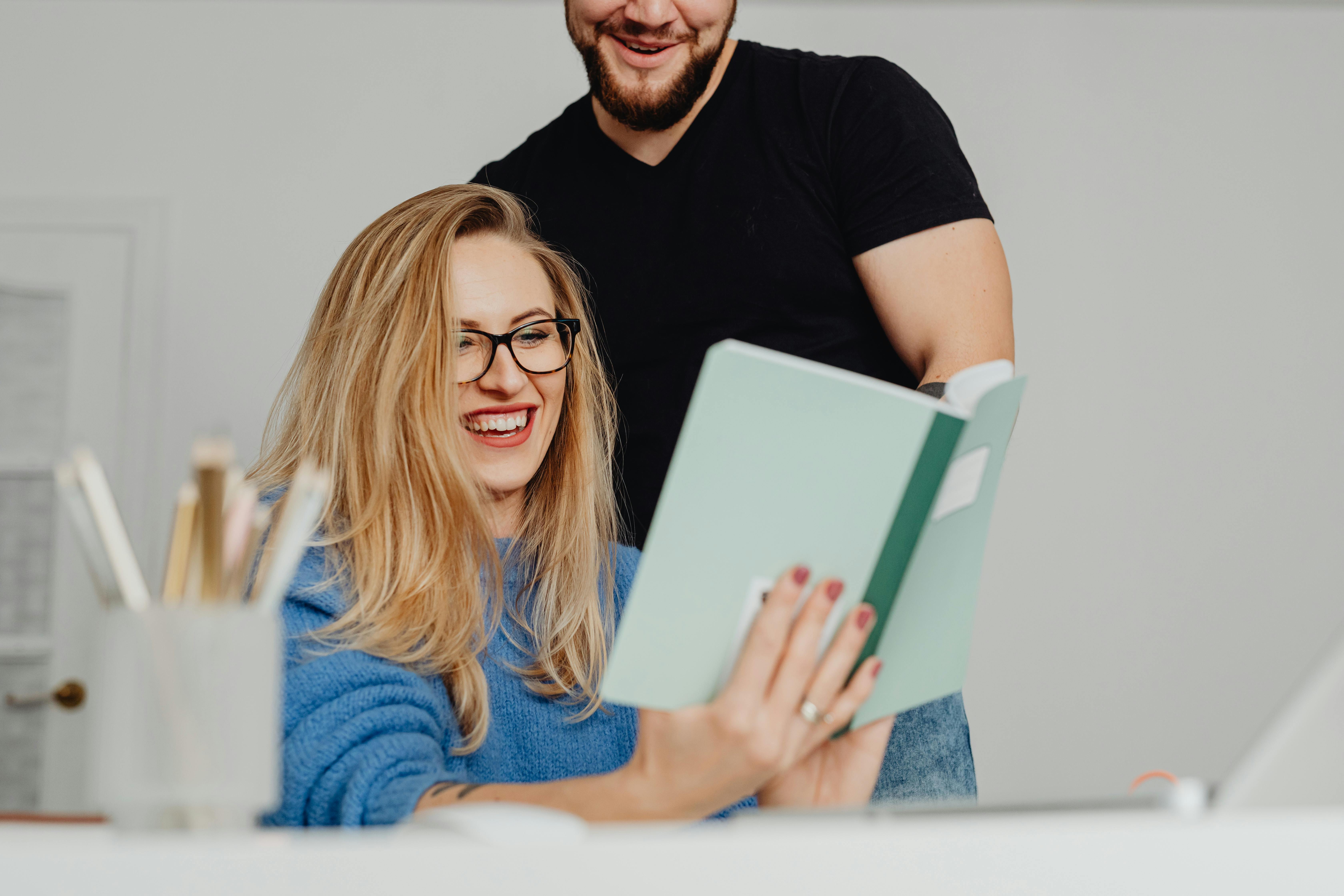 Happy People Working with Notebook