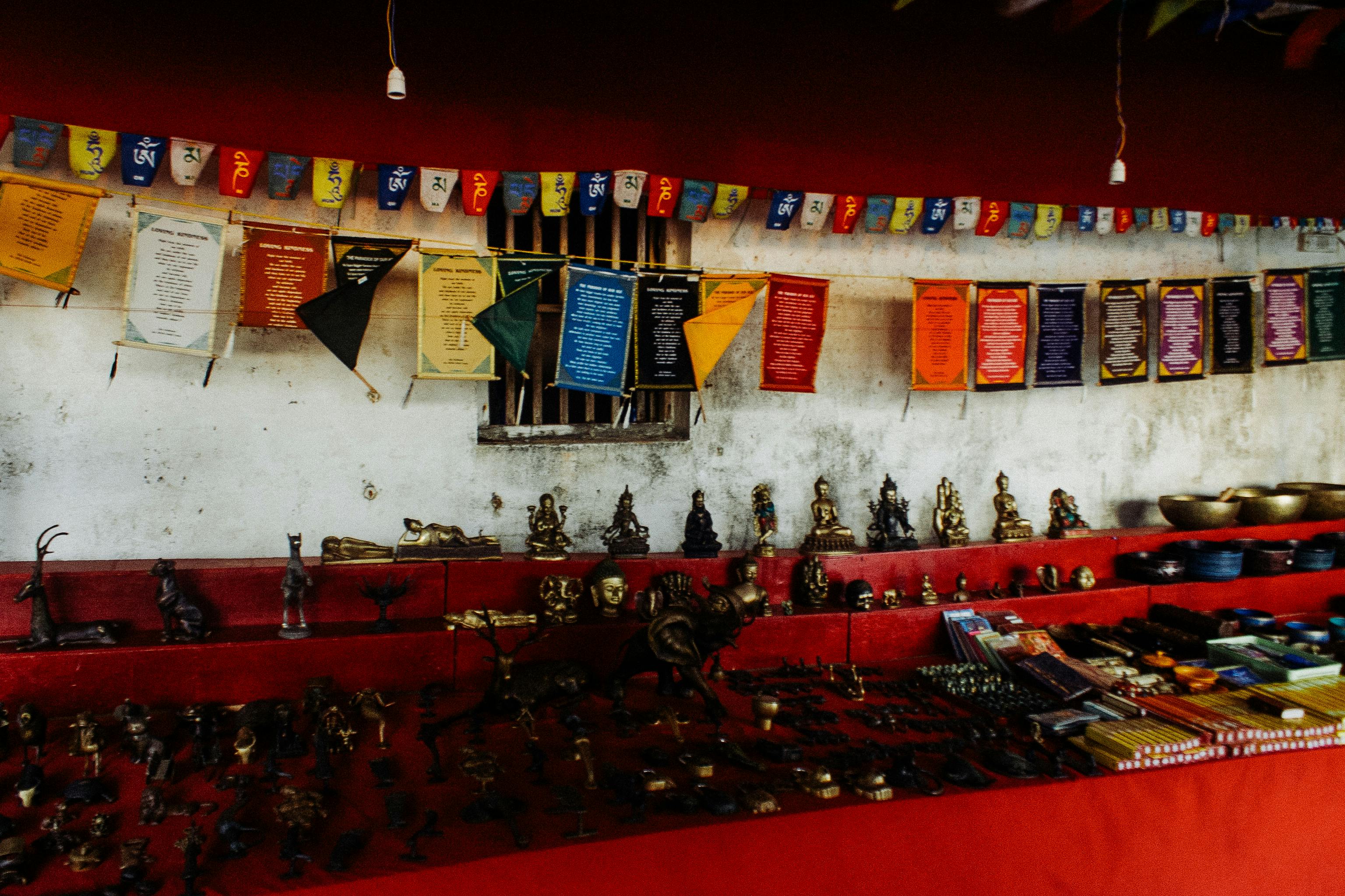 Assorted copper oriental souvenirs aroma sticks presented on stall with red cover in indigenous bazaar