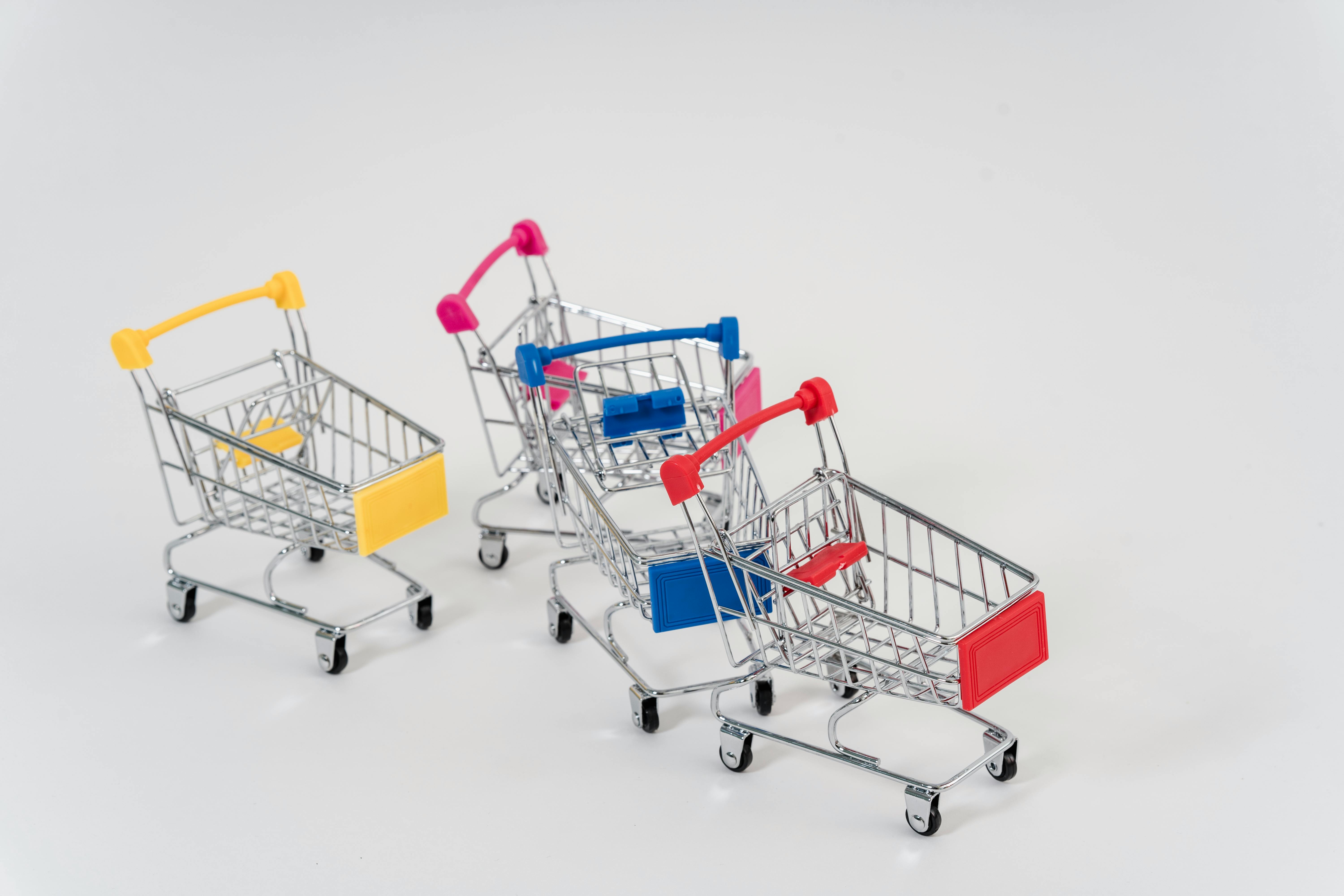 Close-Up Photo Of Mini Push Carts With Different Colors