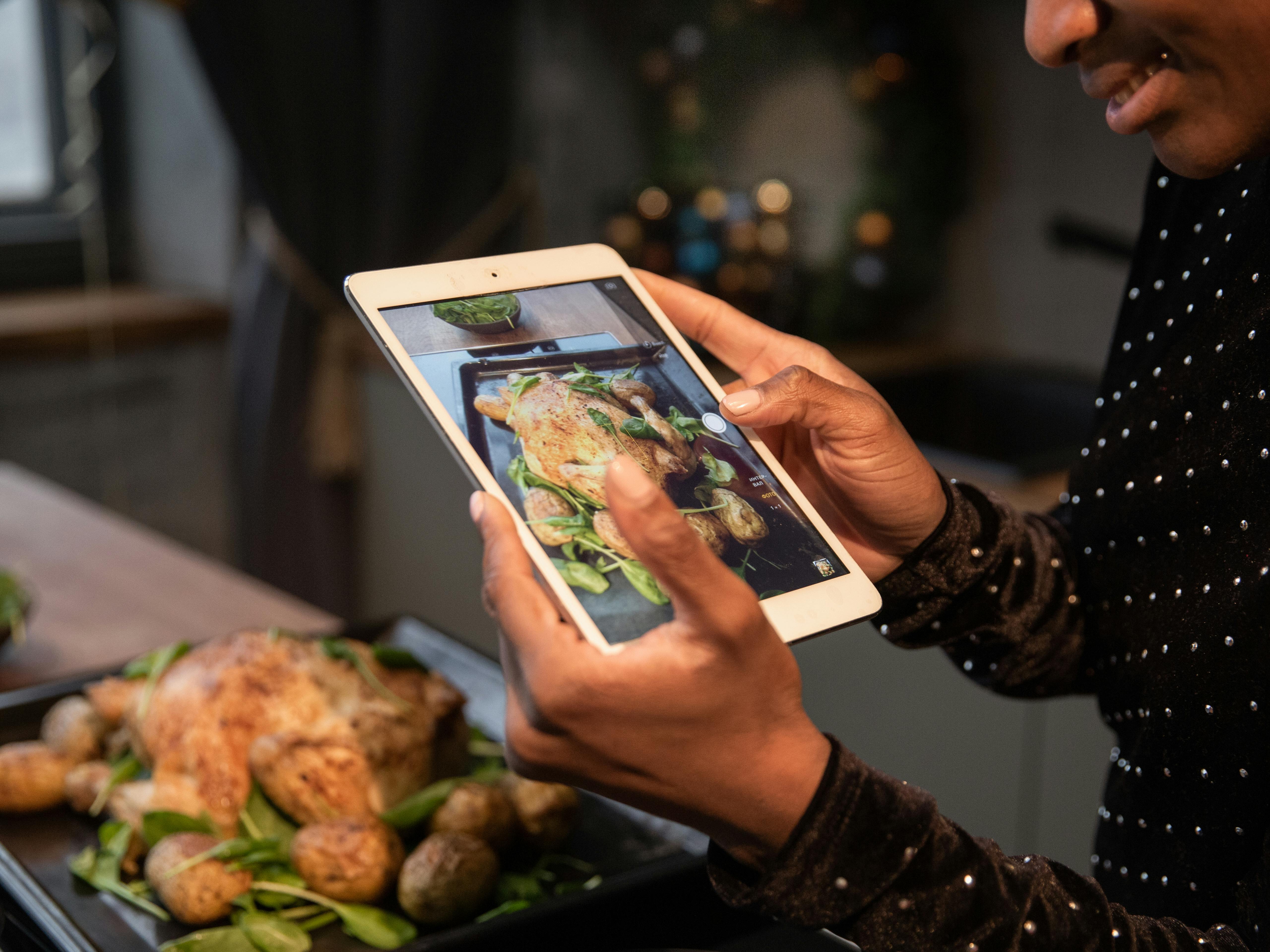 Person Taking a Picture of Food