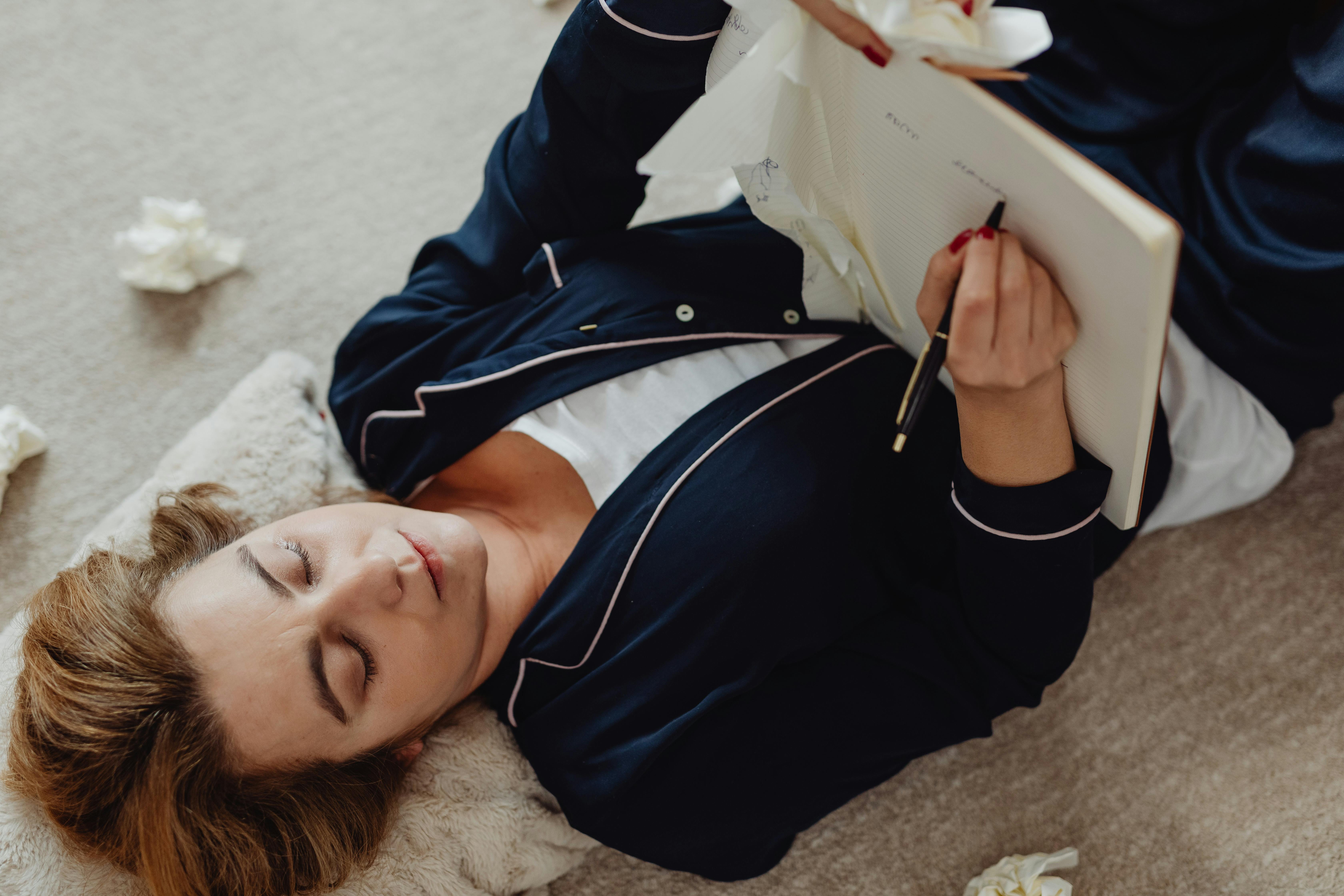 Female Writing while Lying on the Floor