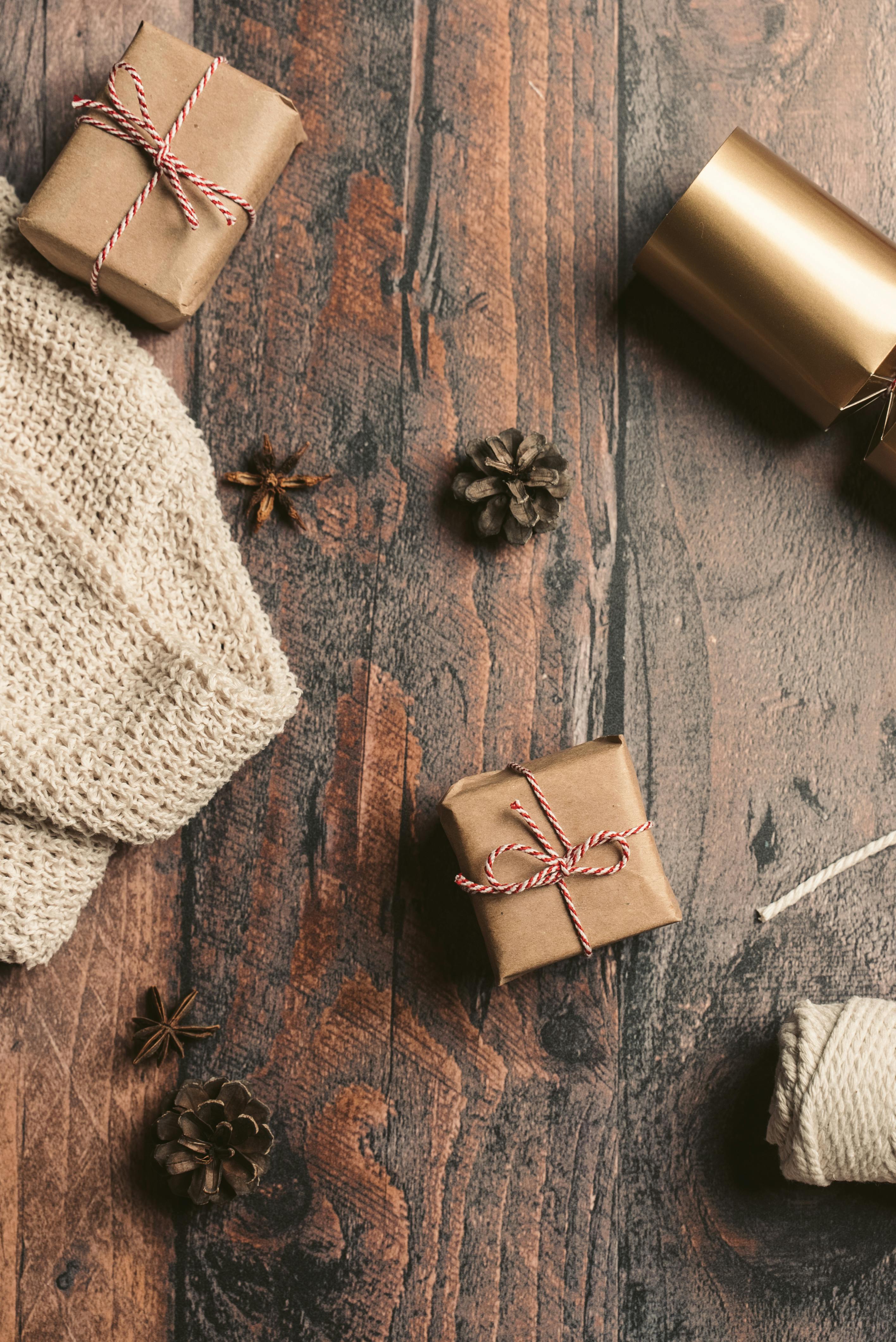 Close Up Photo of Gifts on Wooden Surface