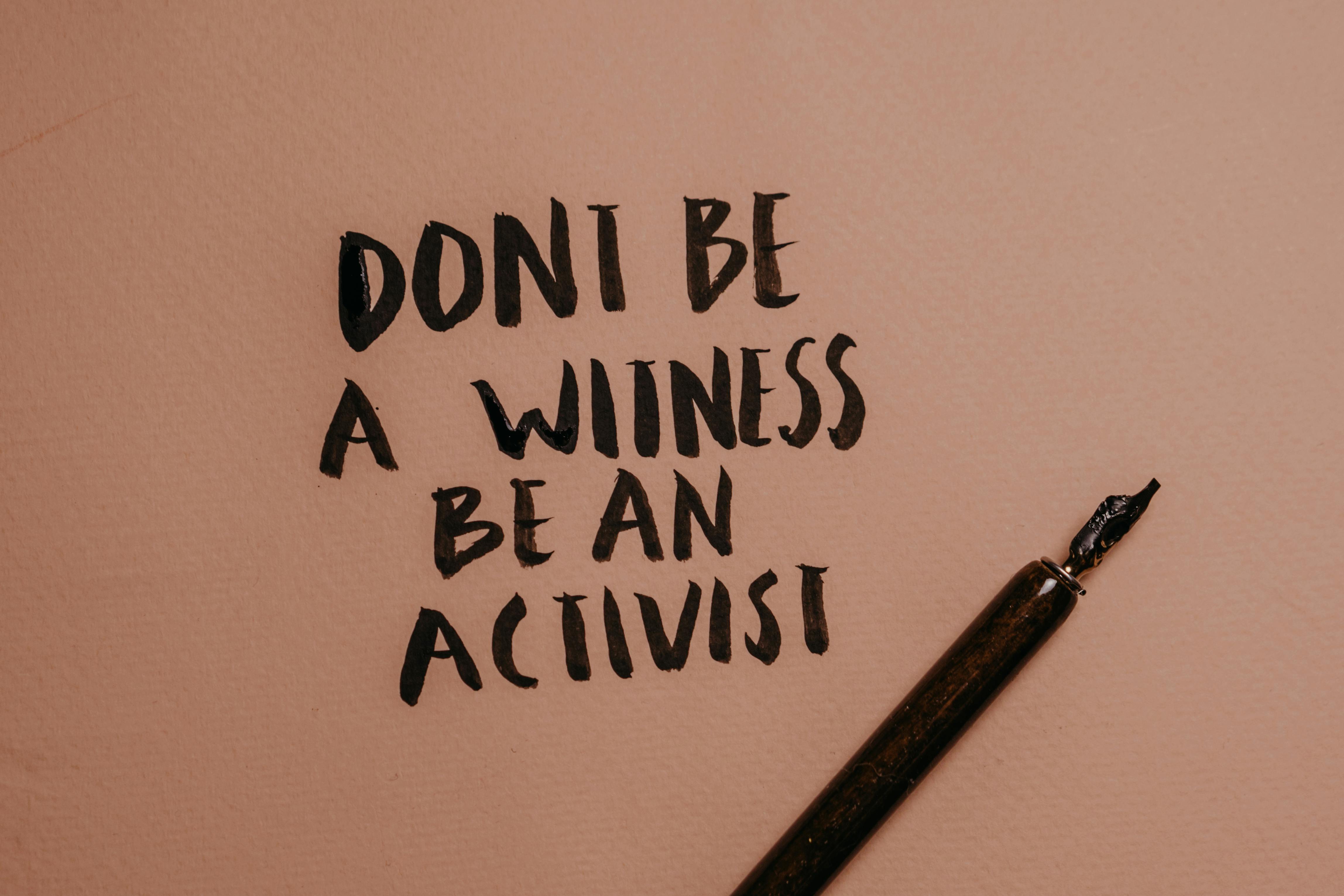 A Close-Up Shot of a Handwritten Quote beside a Fountain Pen