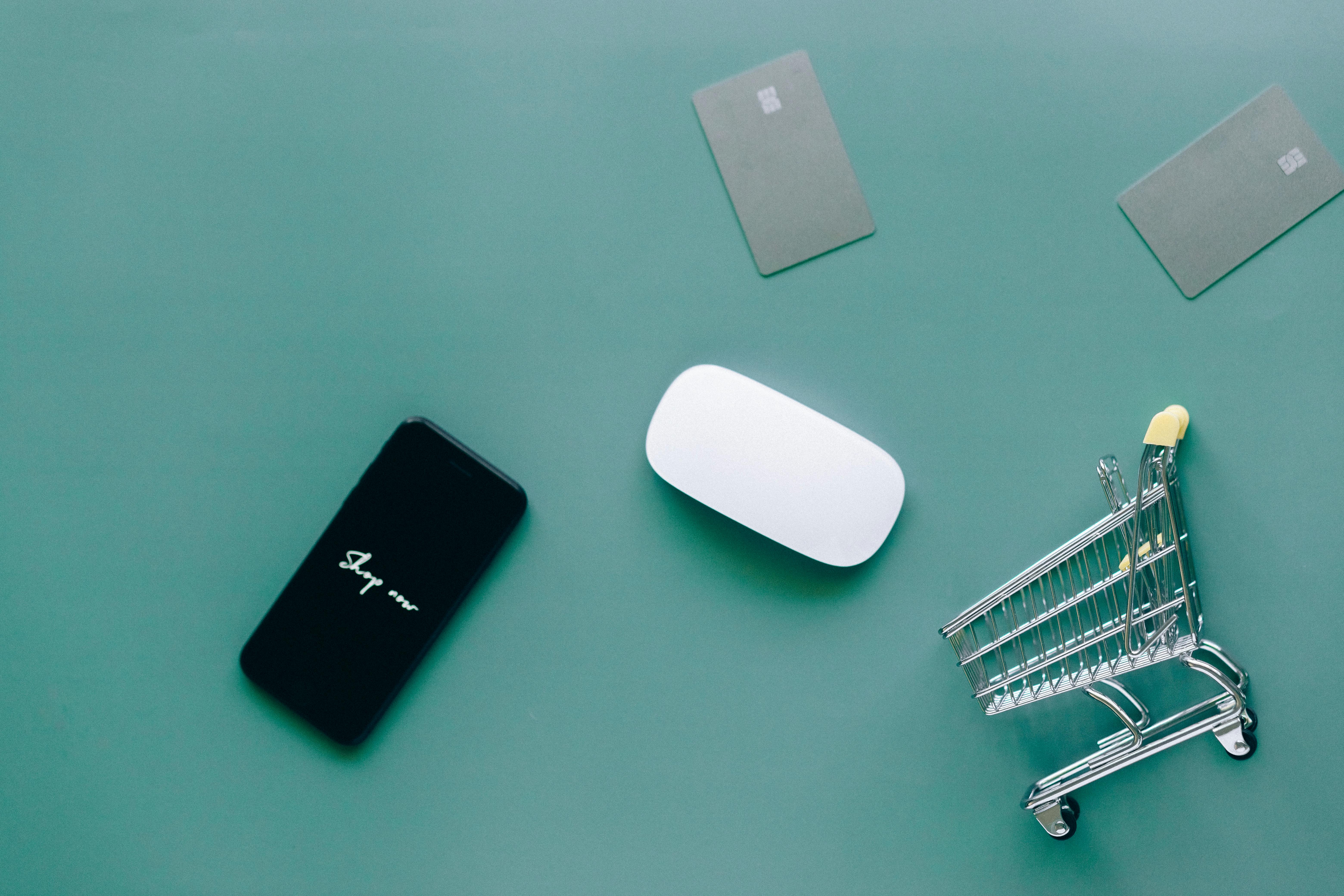 Black Smartphone on Green Table