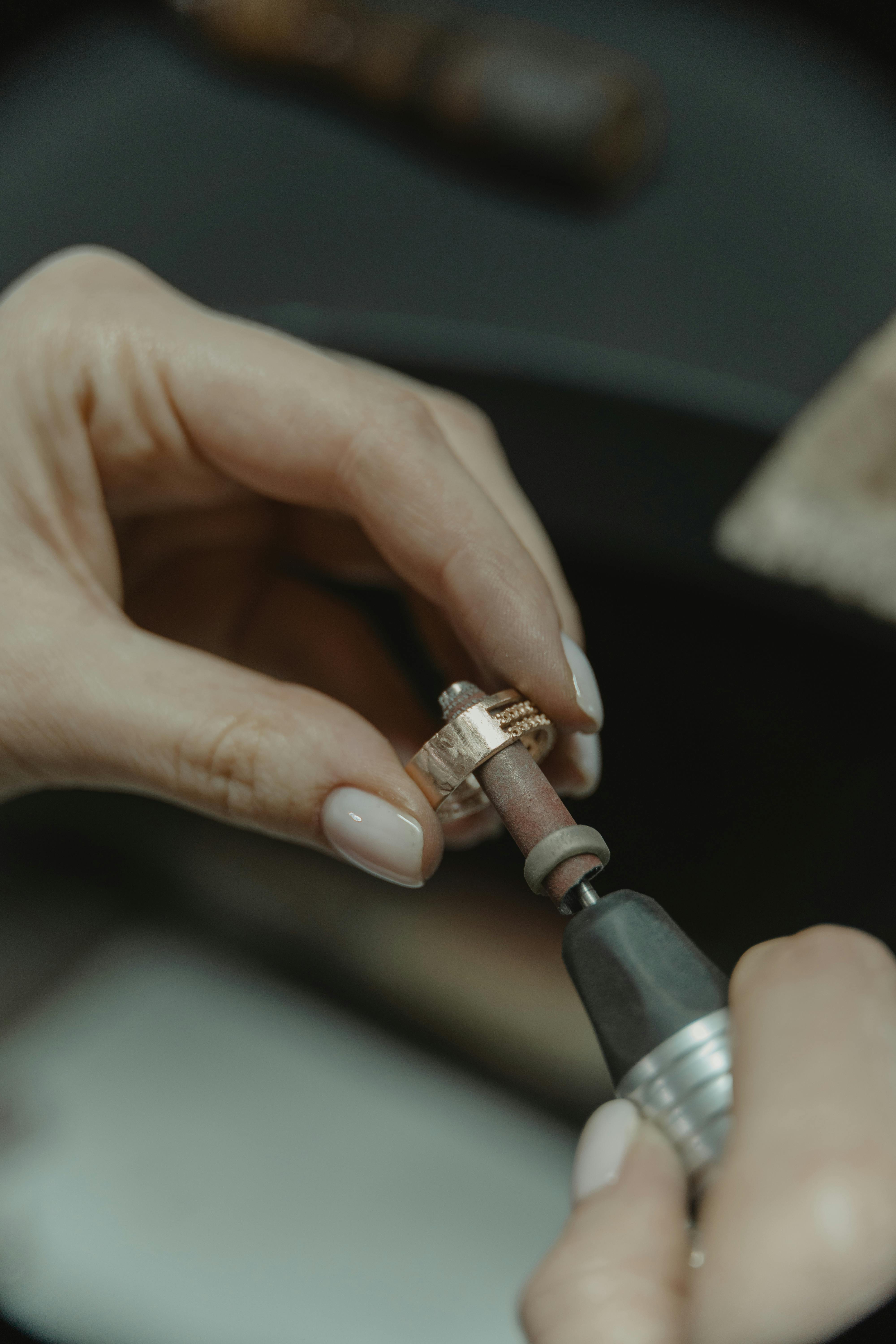 Person Designing a Gold Ring