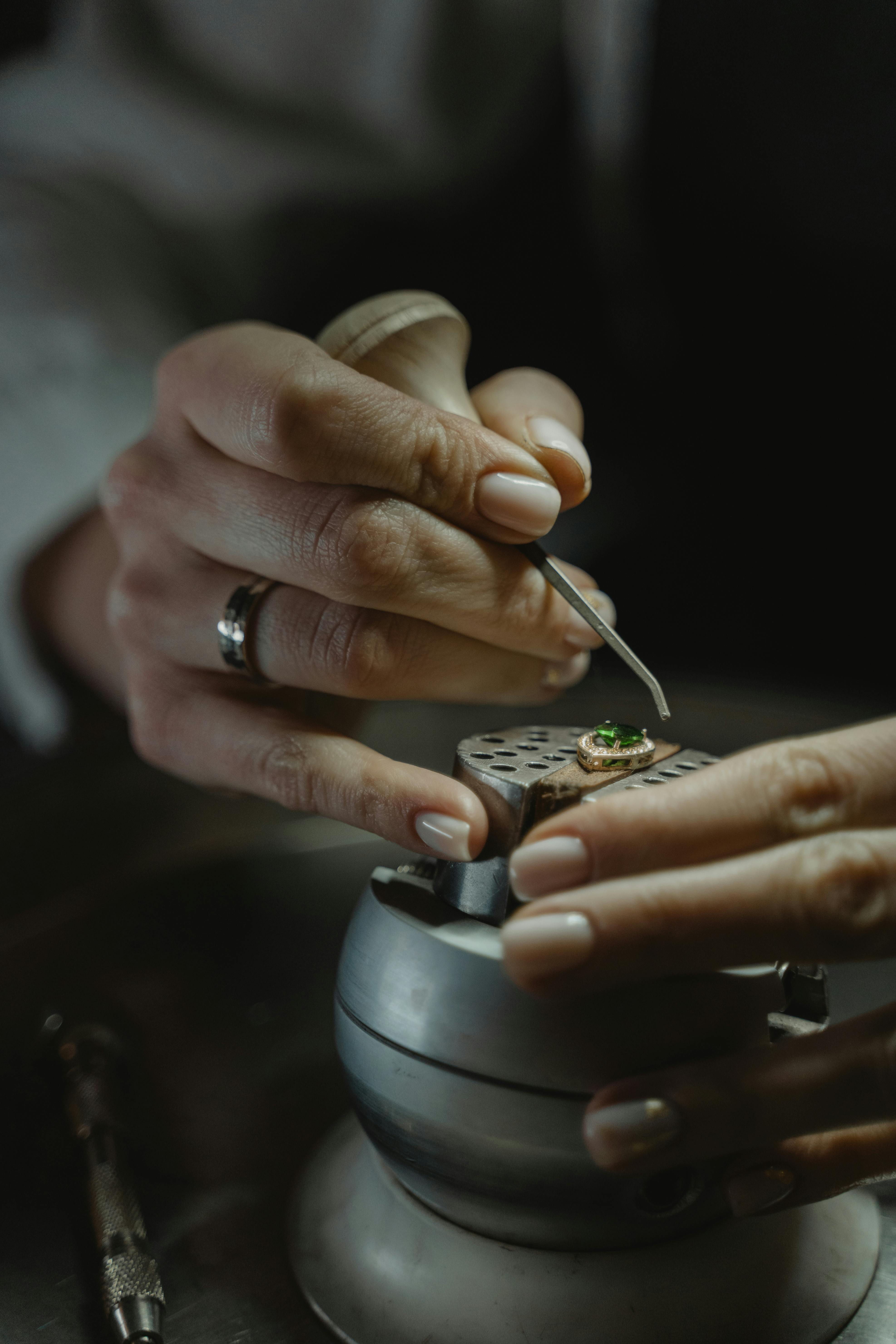 A Jeweler Handling an Emerald