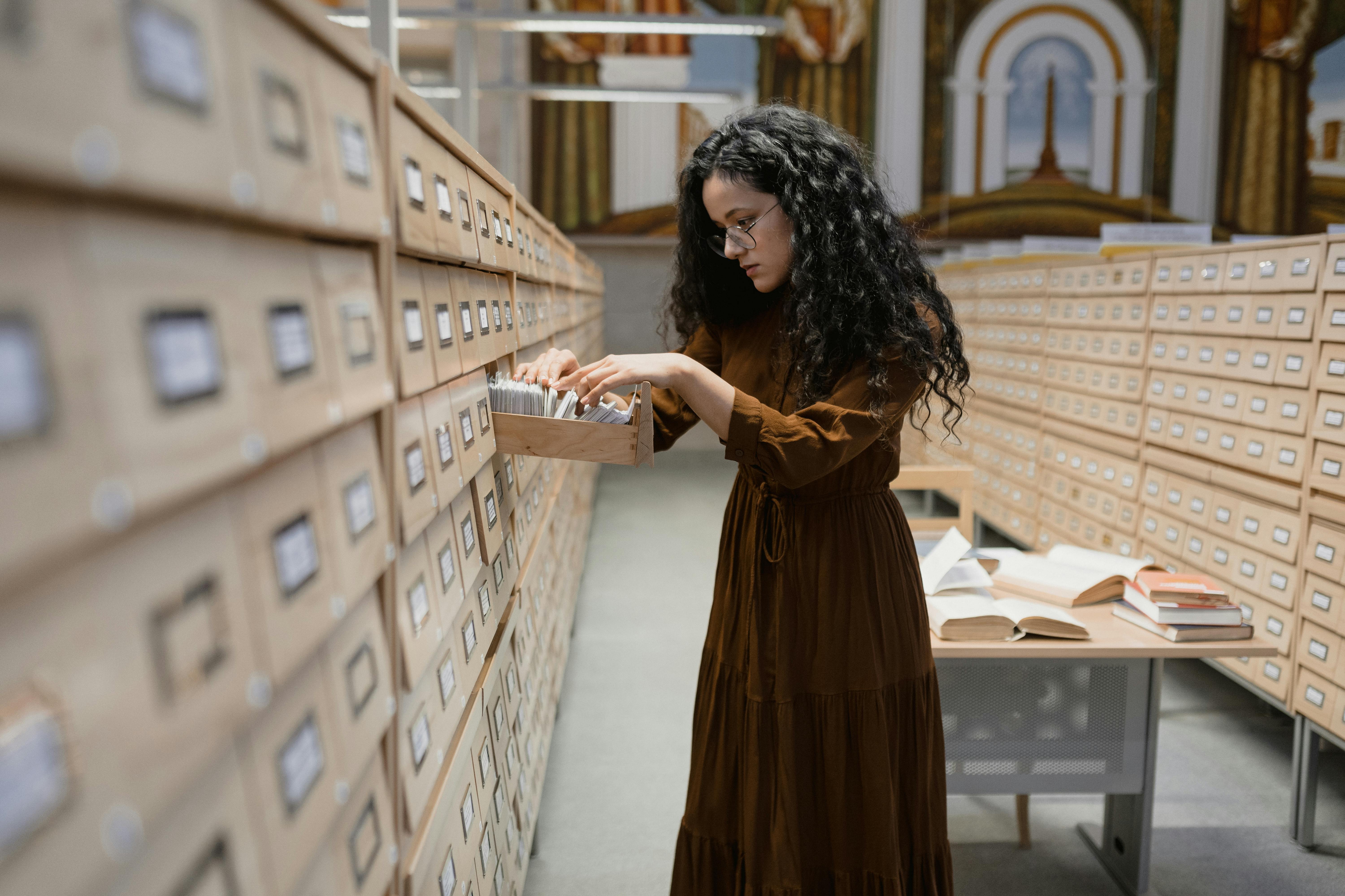 Student looking at an Archive Drawer