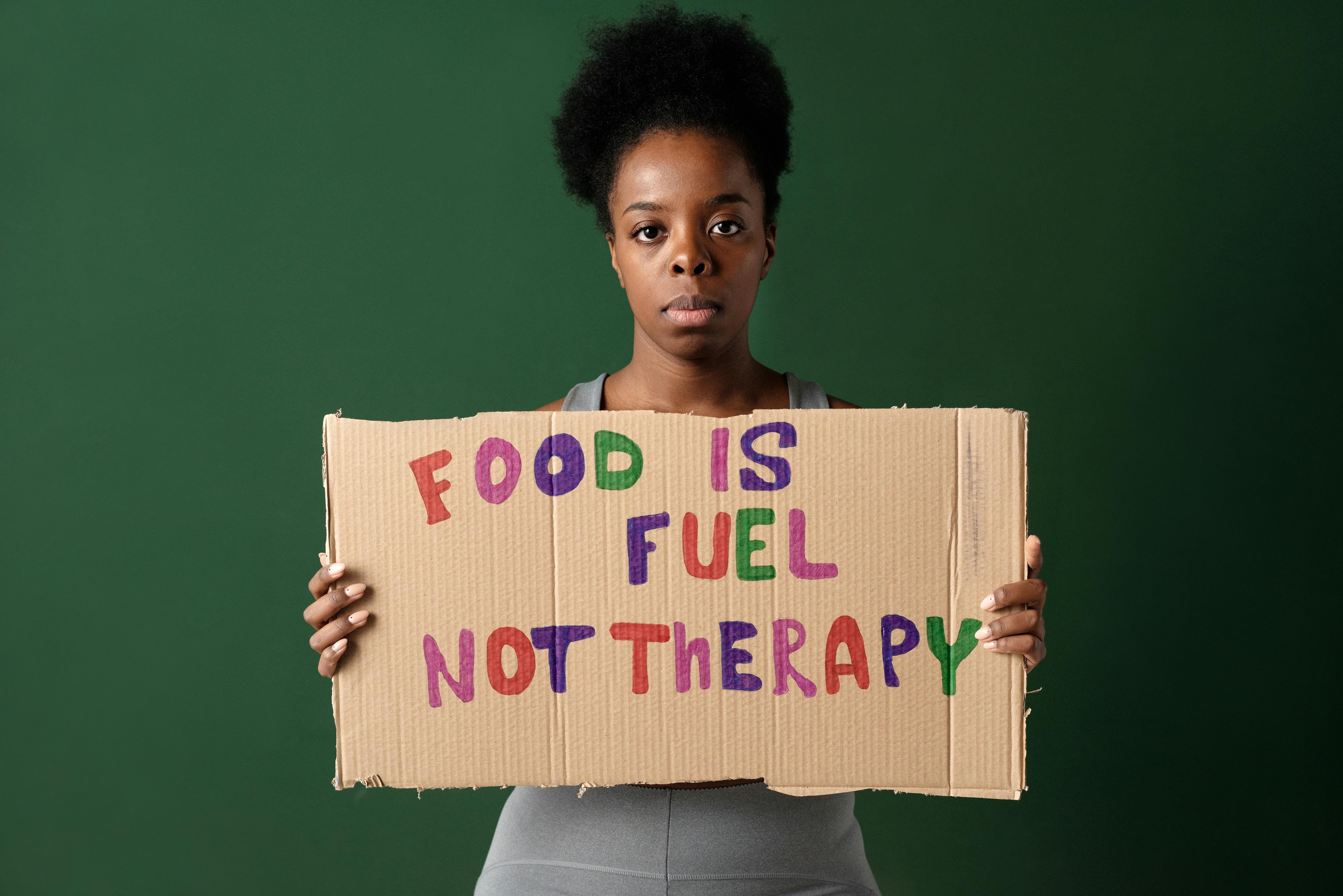 Woman Holding a Handmade Placard