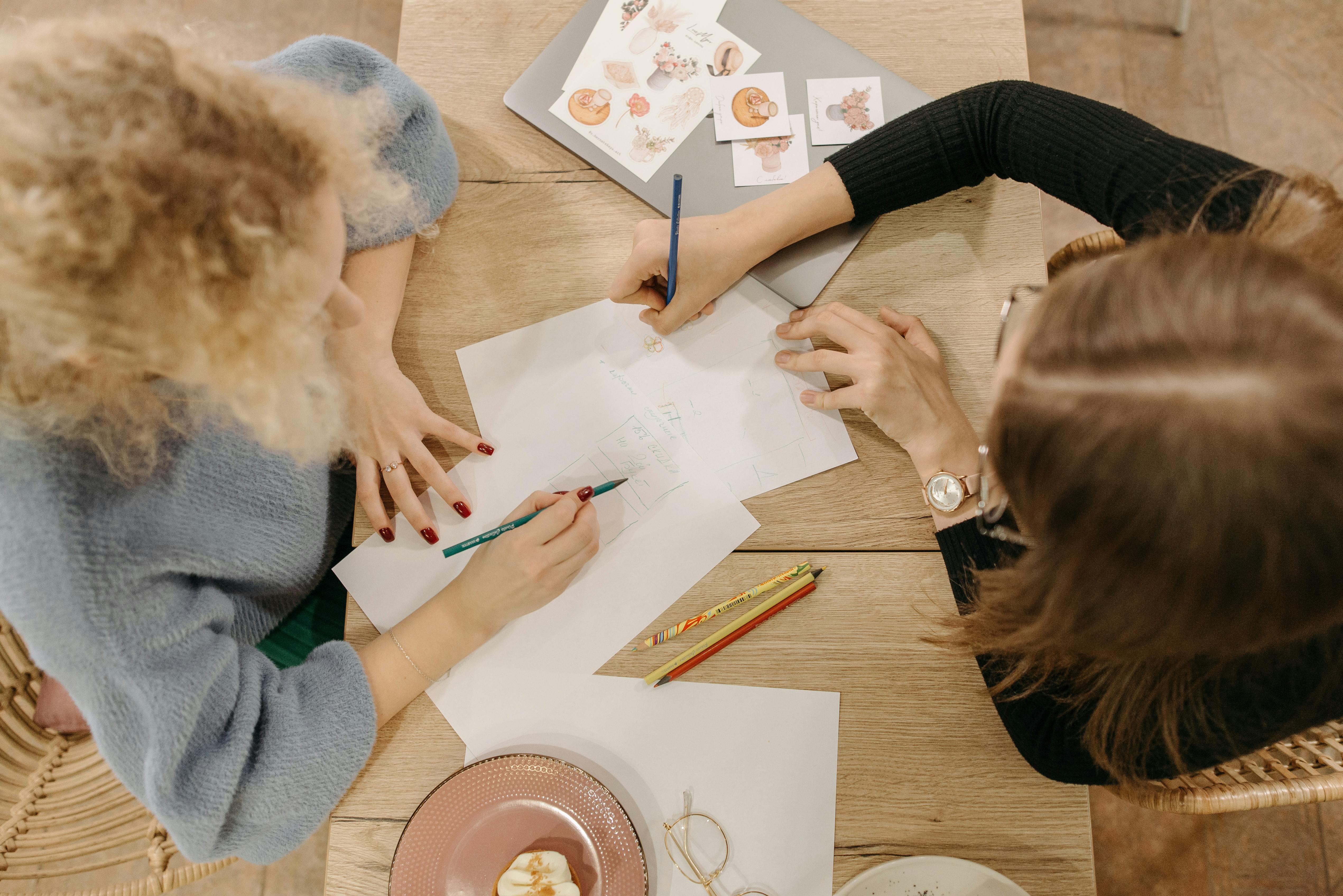 Women Drawing on Paper