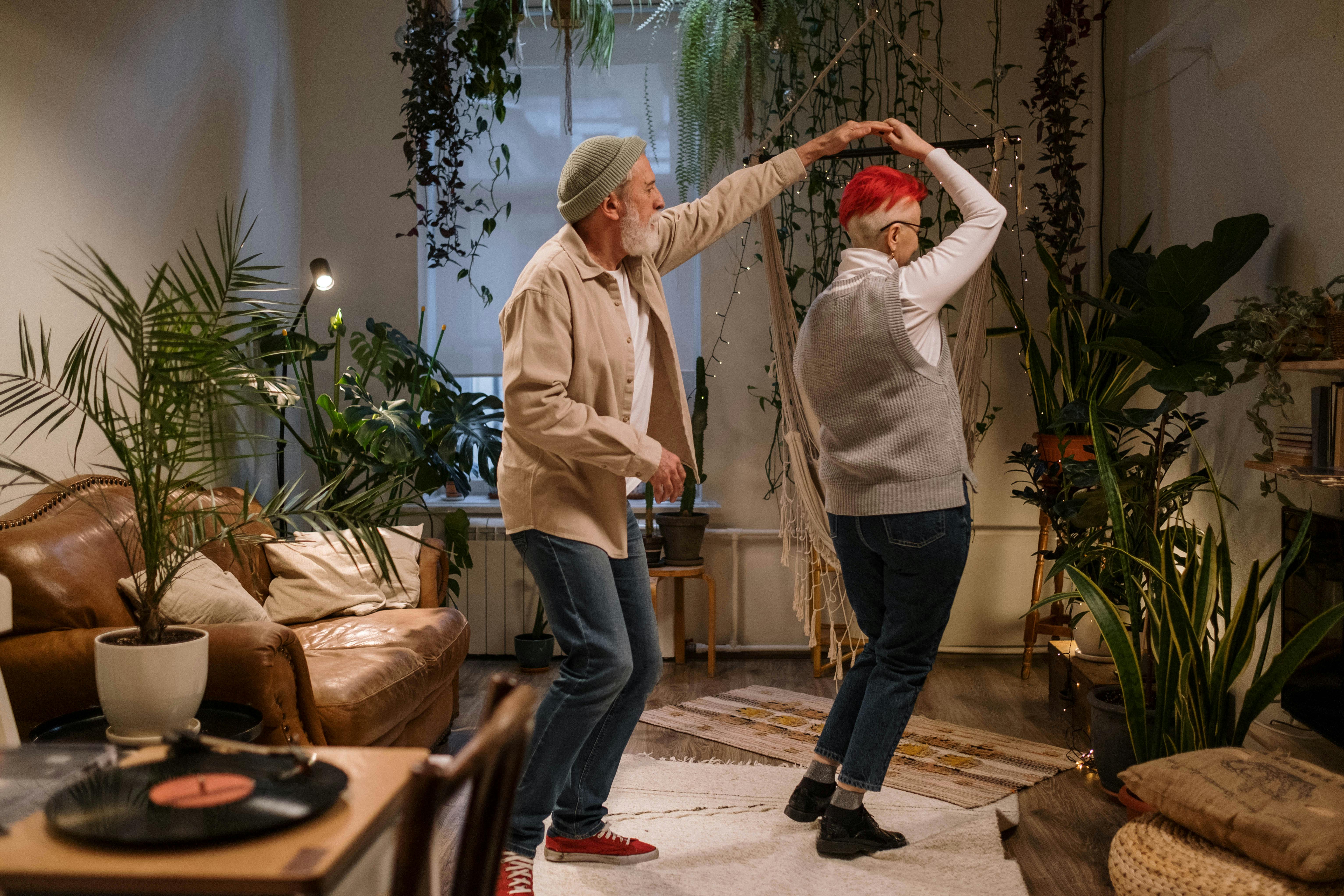 Photograph of an Elderly Couple Dancing Together in Their Living Room