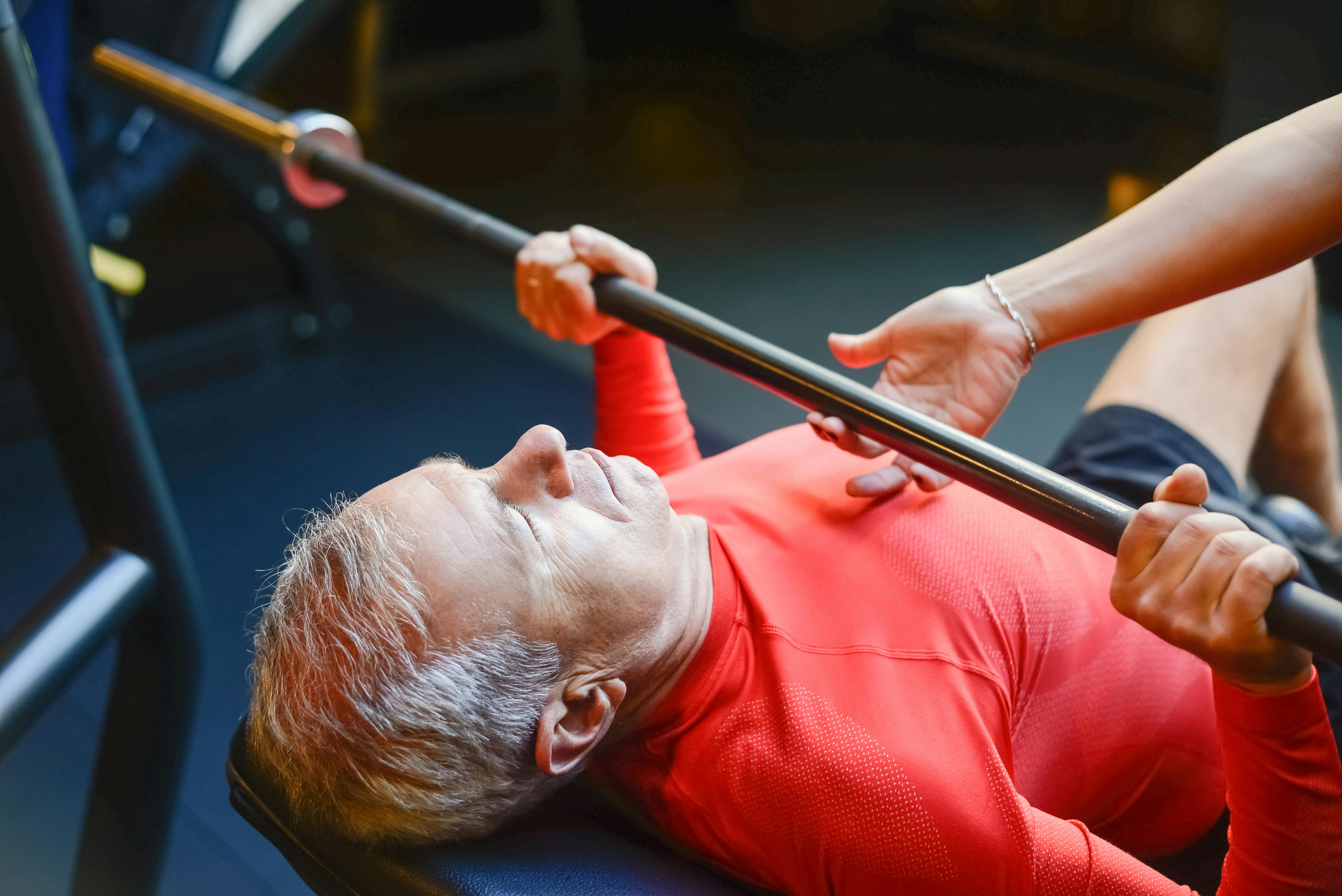 Man Lifting a Bar at the Gym