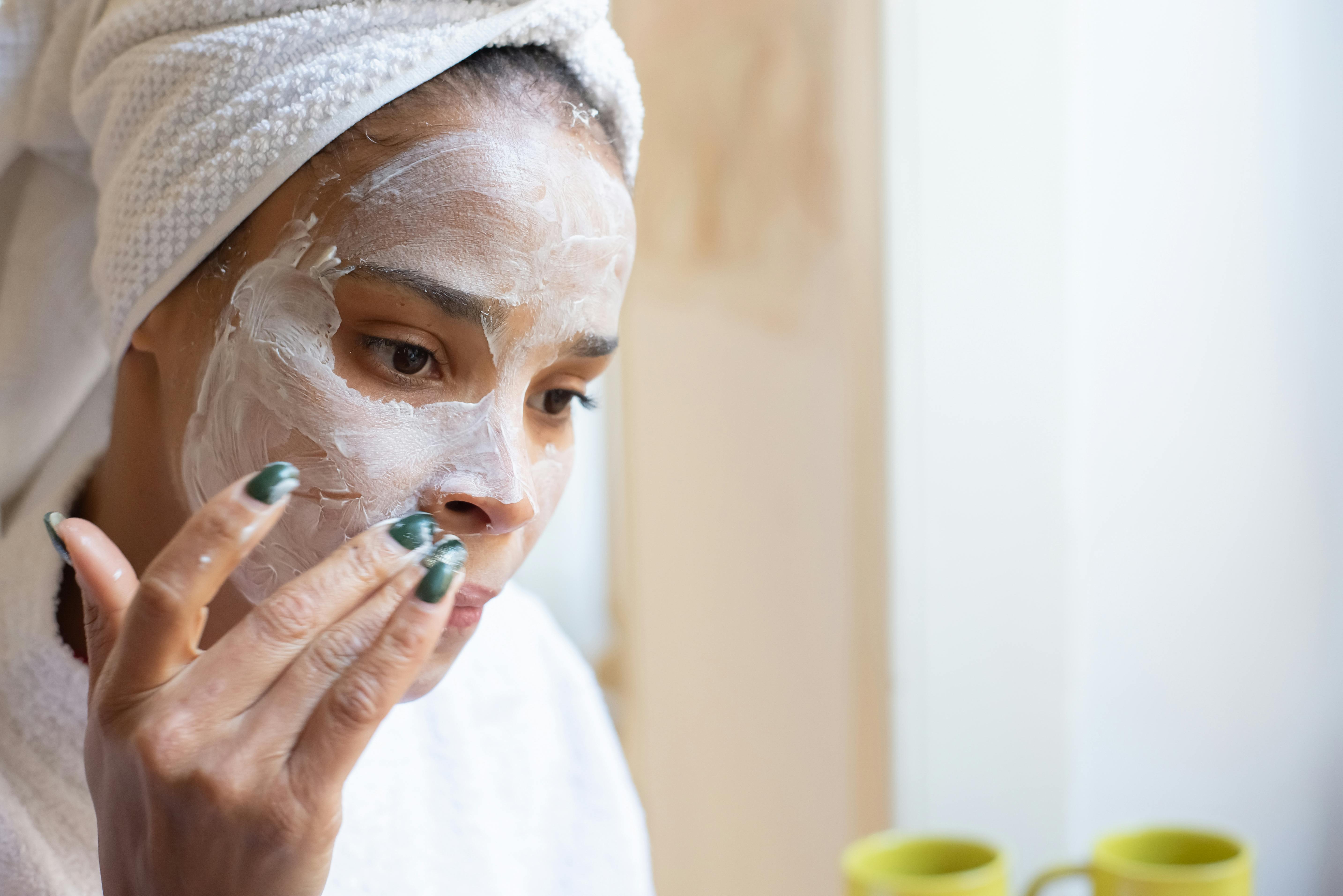 A Woman Applying Facial Cream