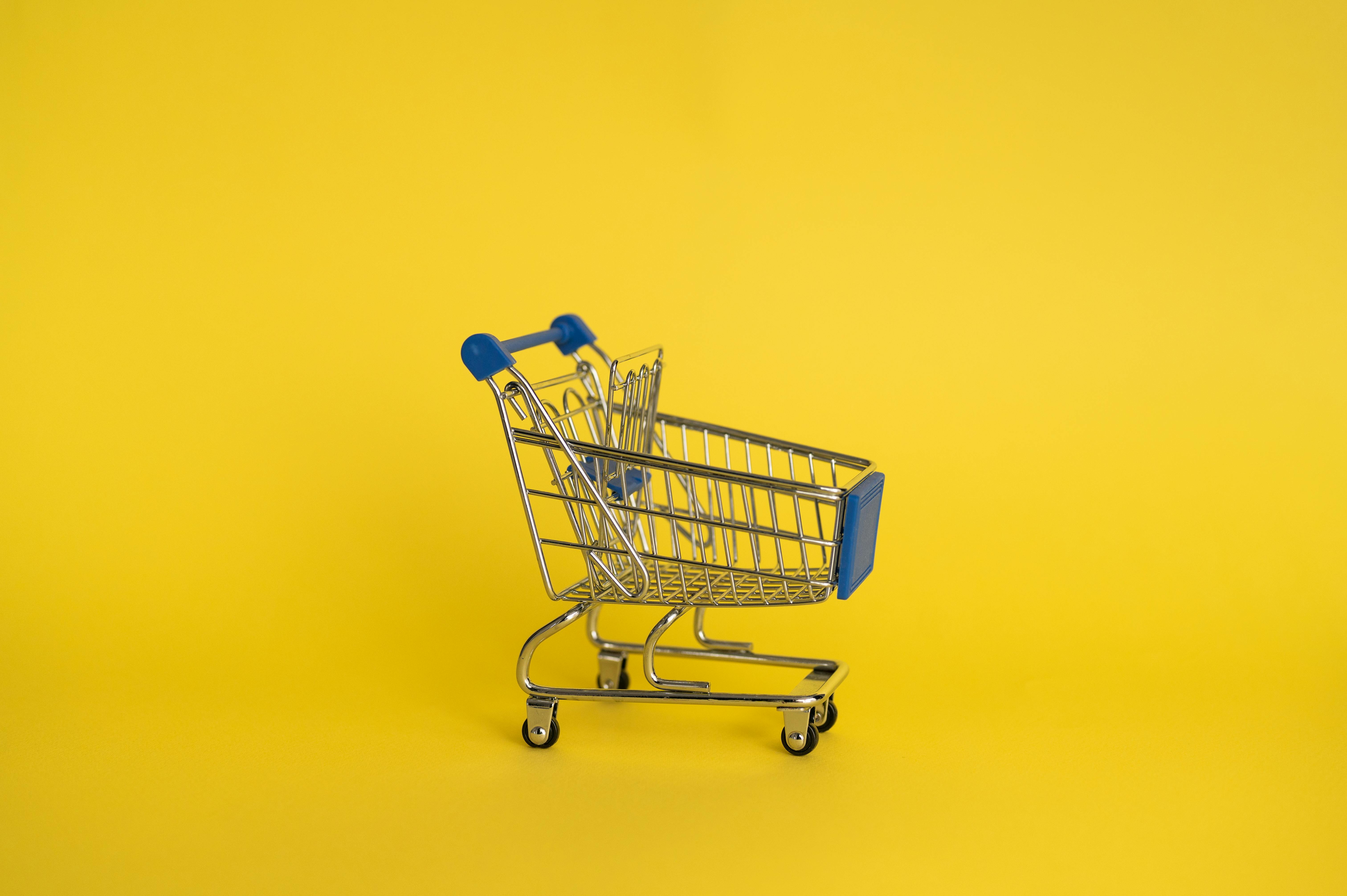 Isolated shining metal shopping trolley