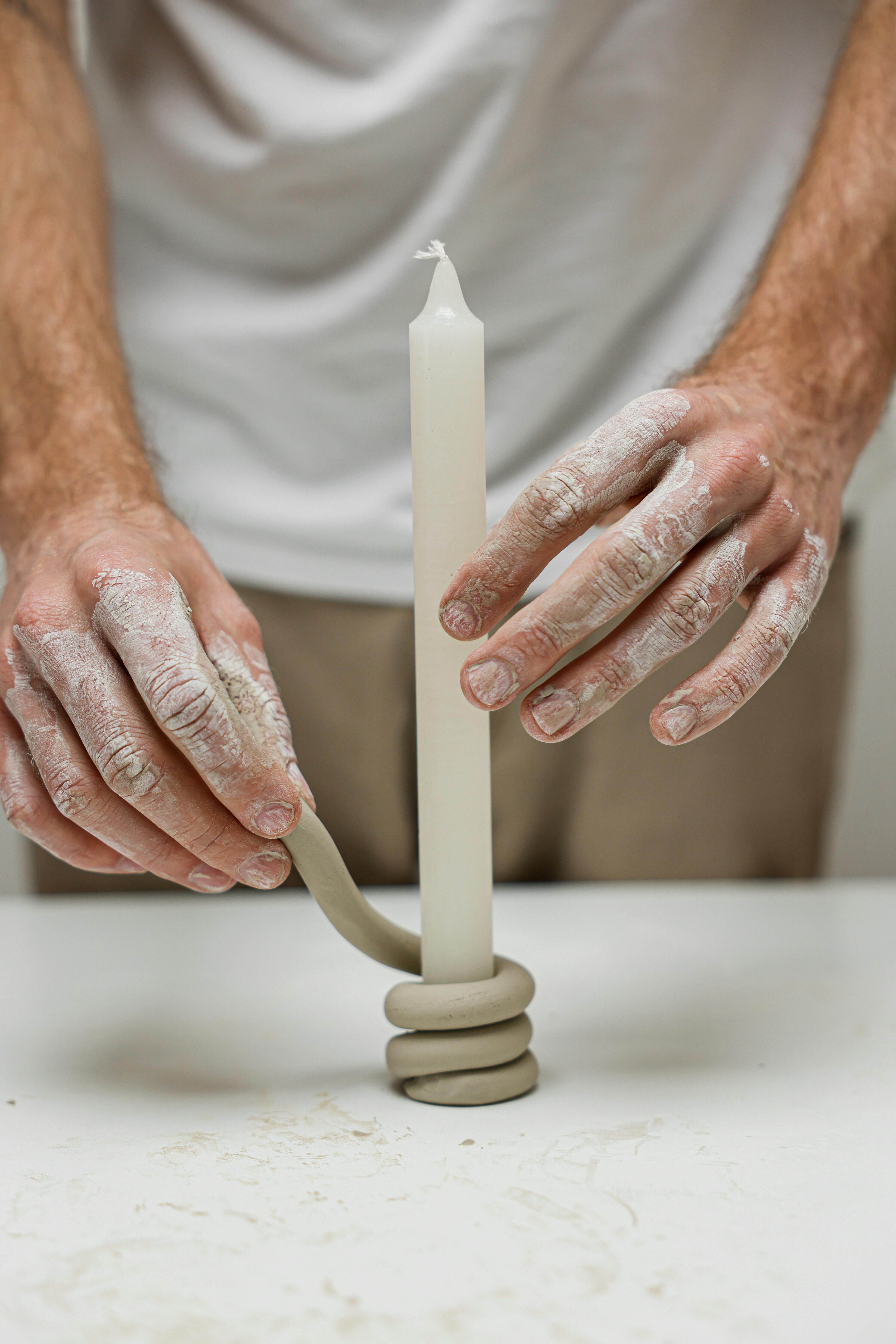 Man Making a Clay Candle Holder