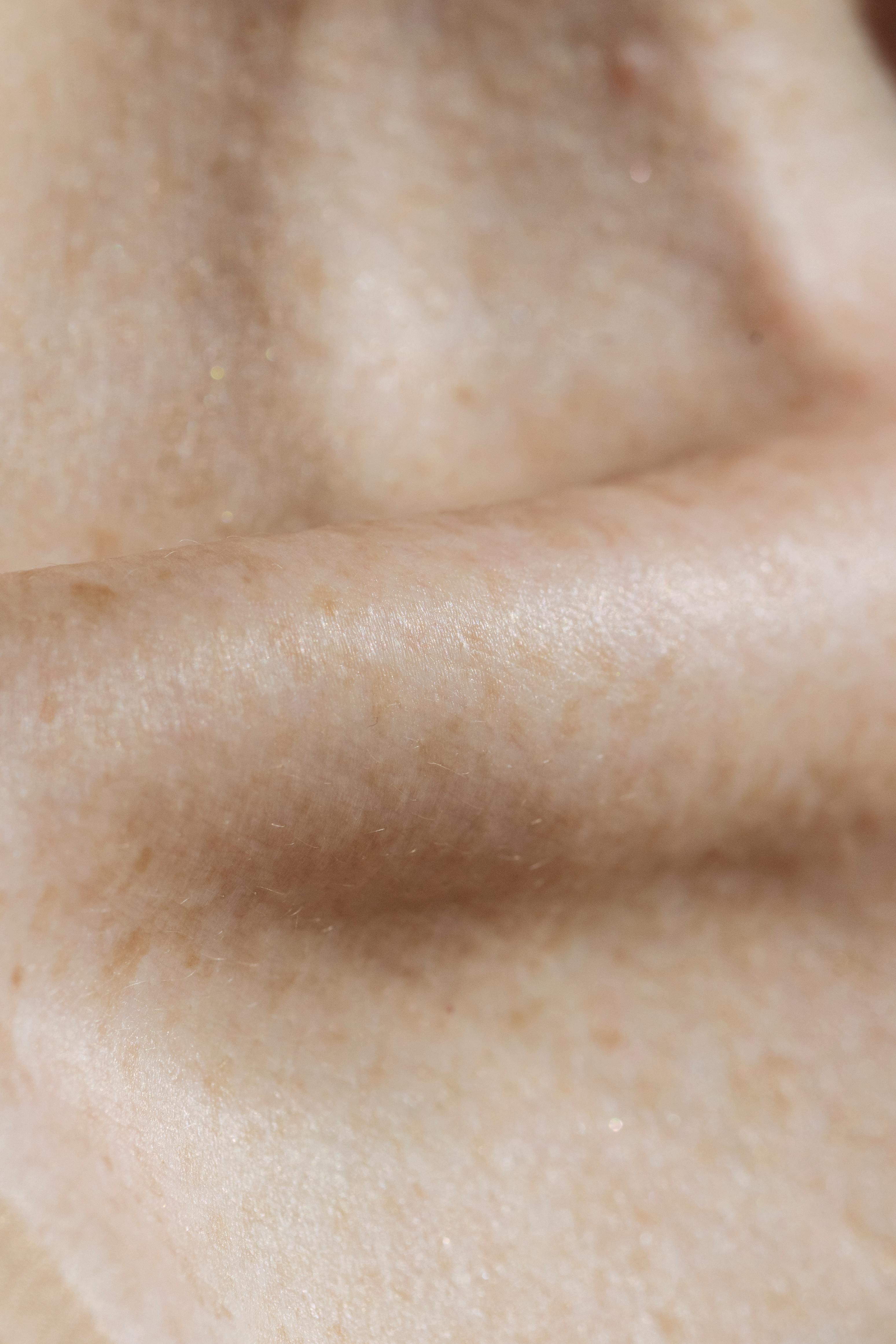 Collarbone under bare glossy skin