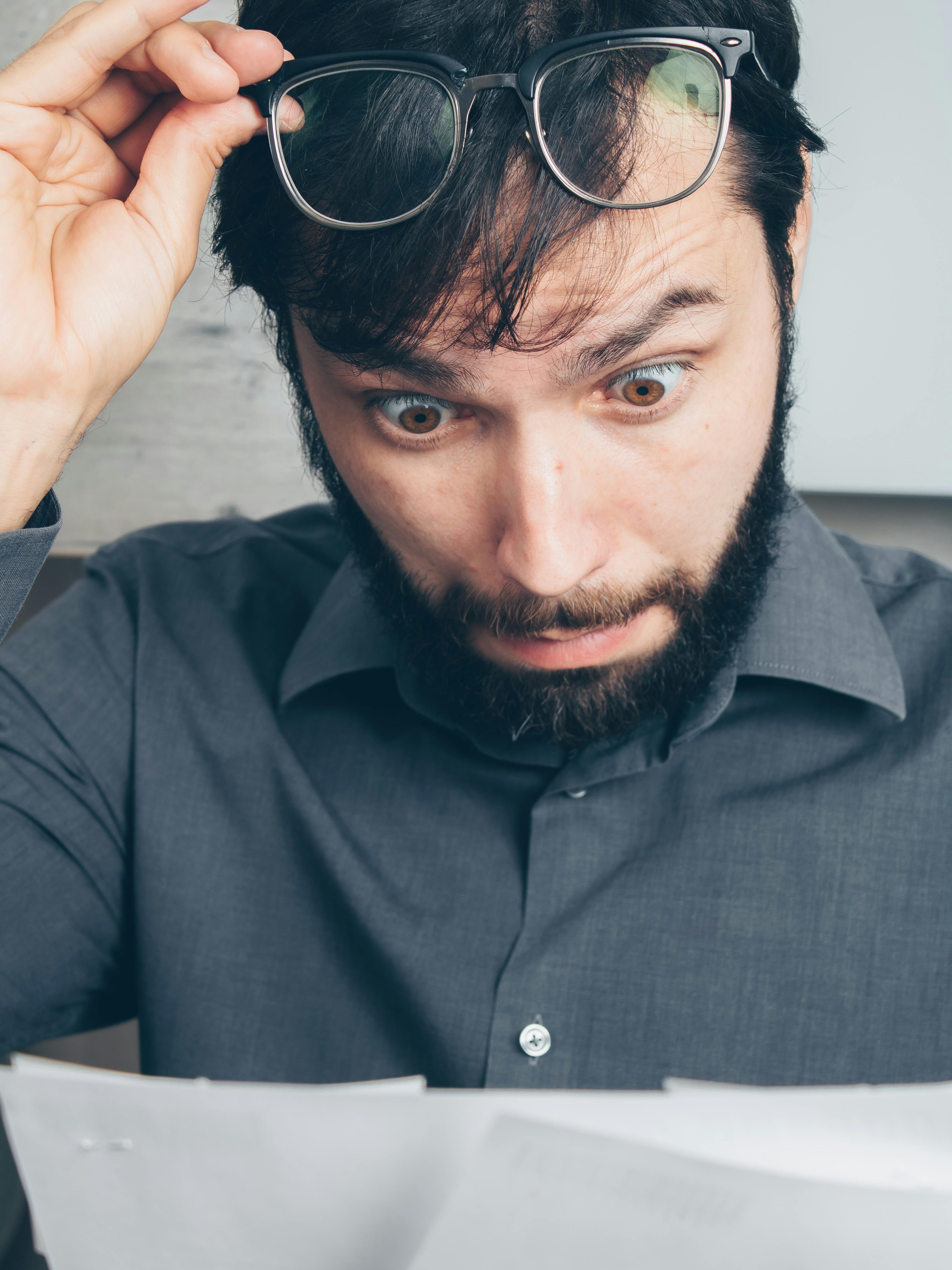 Bearded Man with Eyeglasses Feeling Shocked