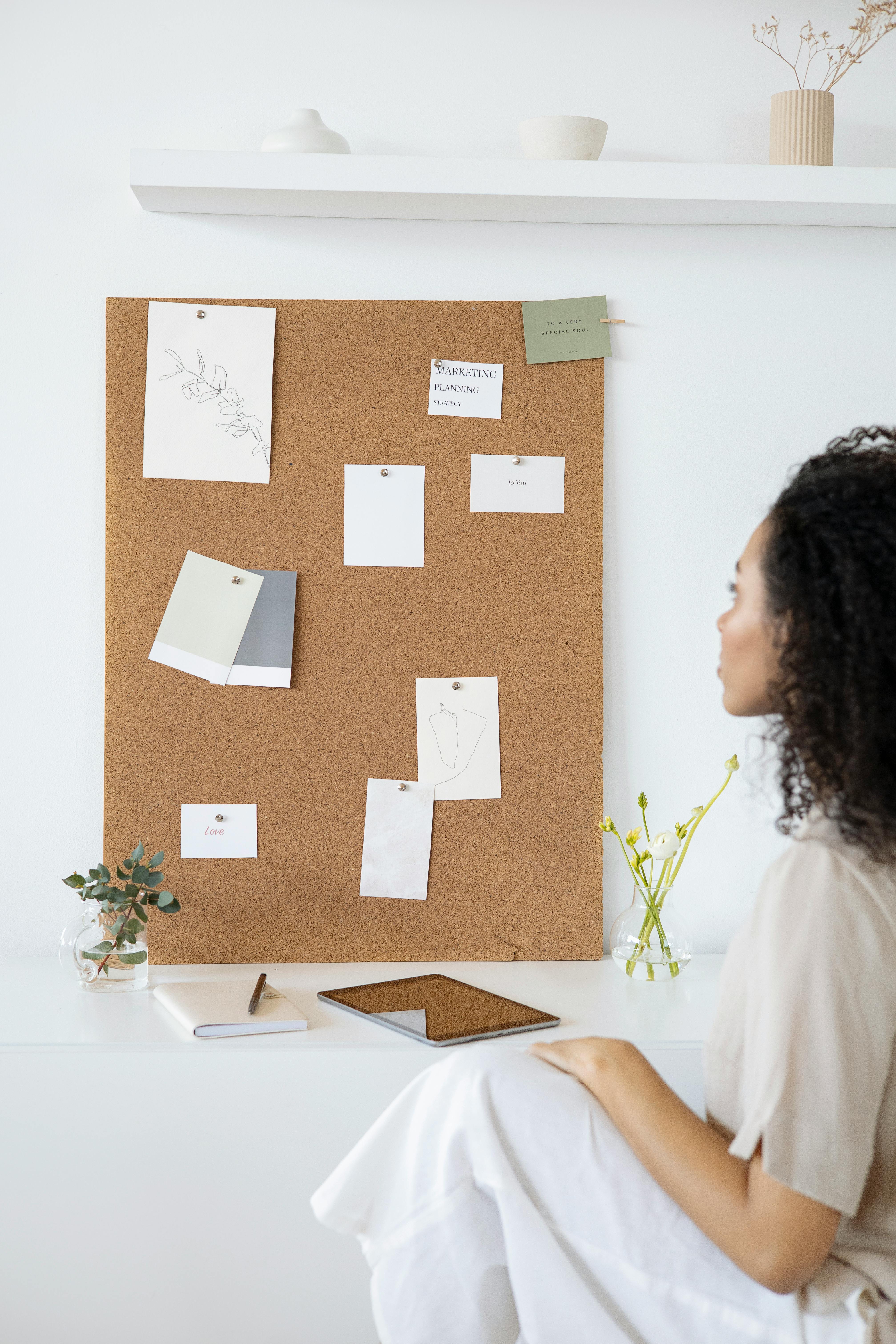 Woman in White Shirt Holding White Printer Paper