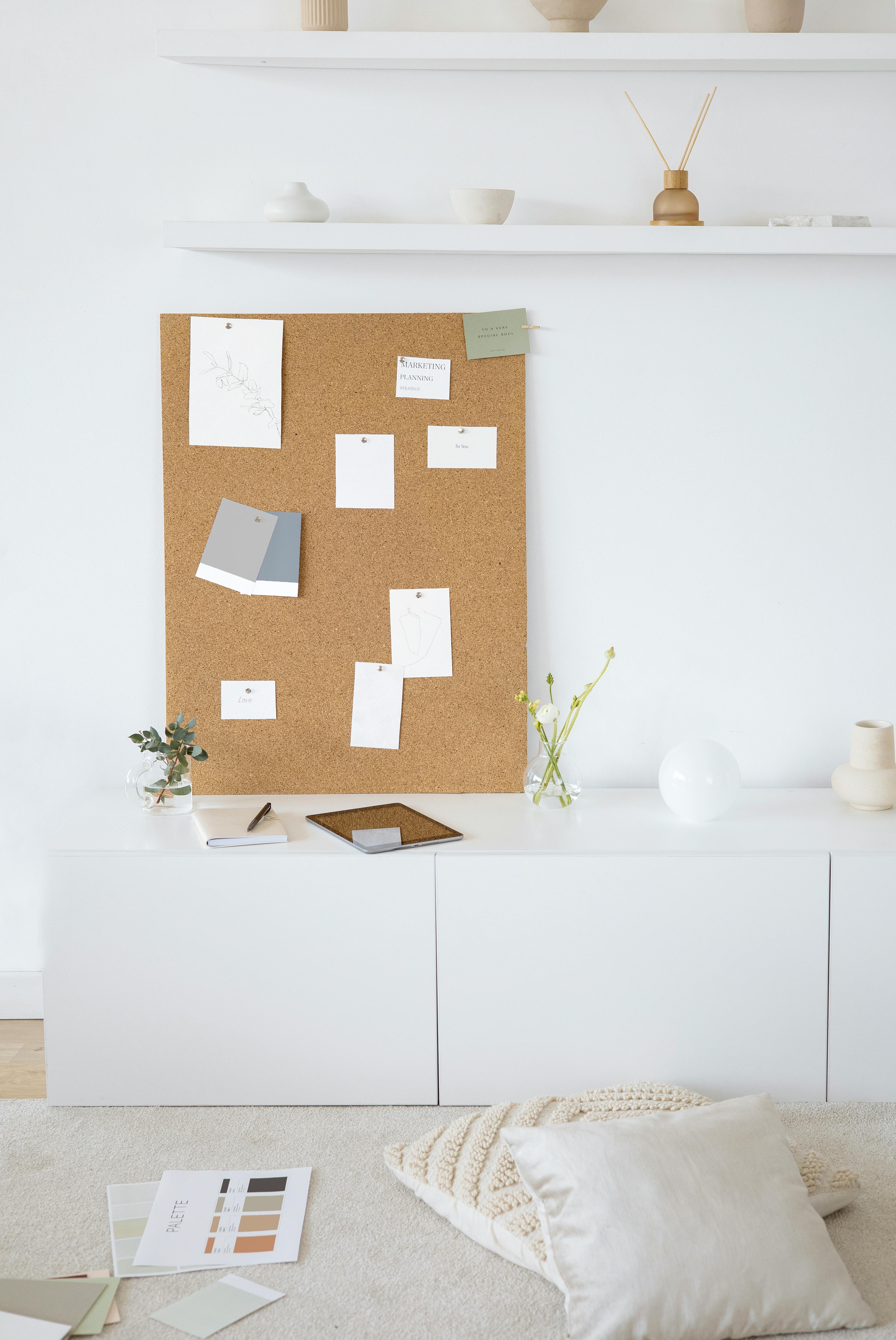 White Wooden Cabinet With Brown Wall Decor