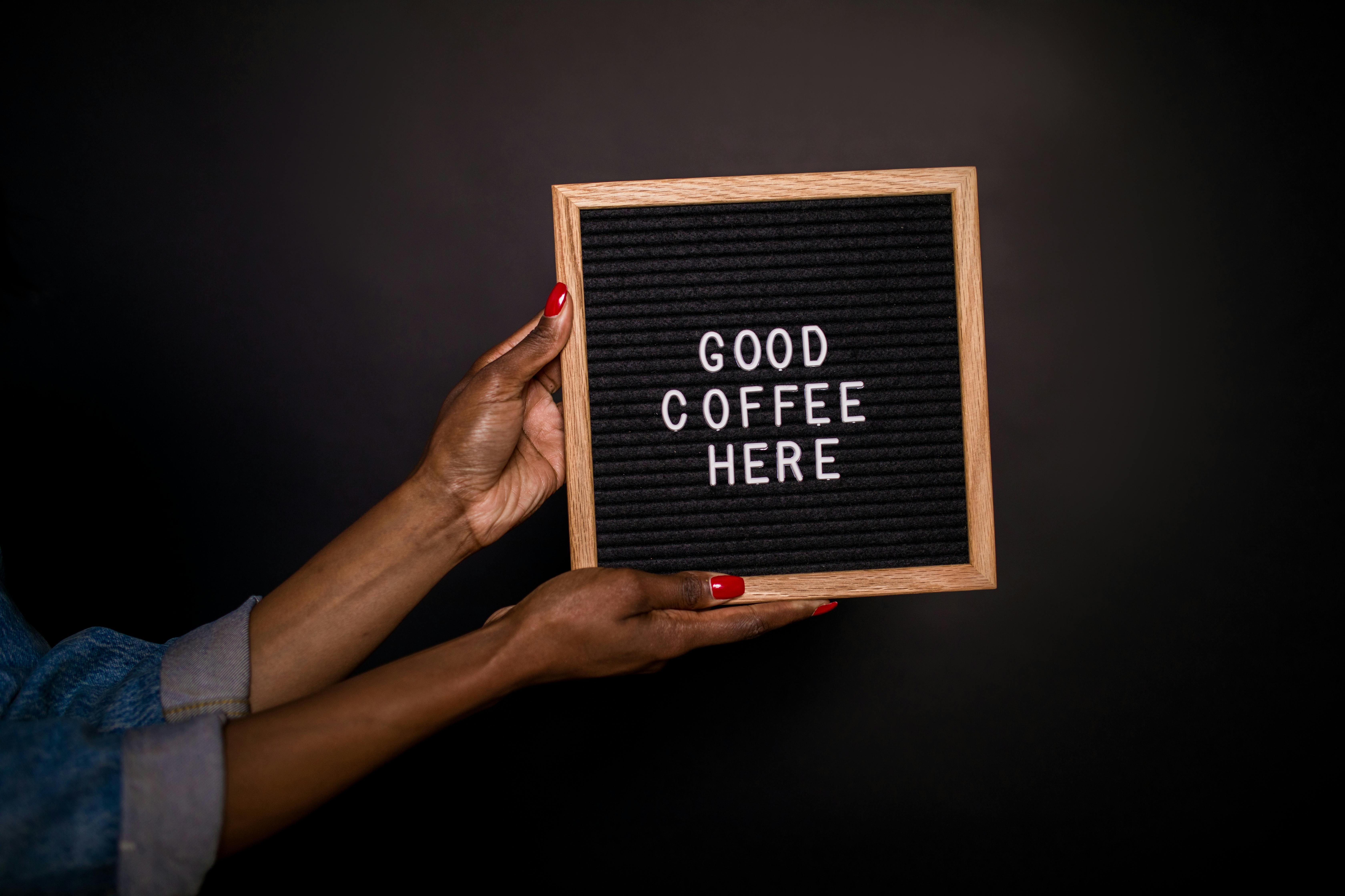 Person Holding a Sign Board