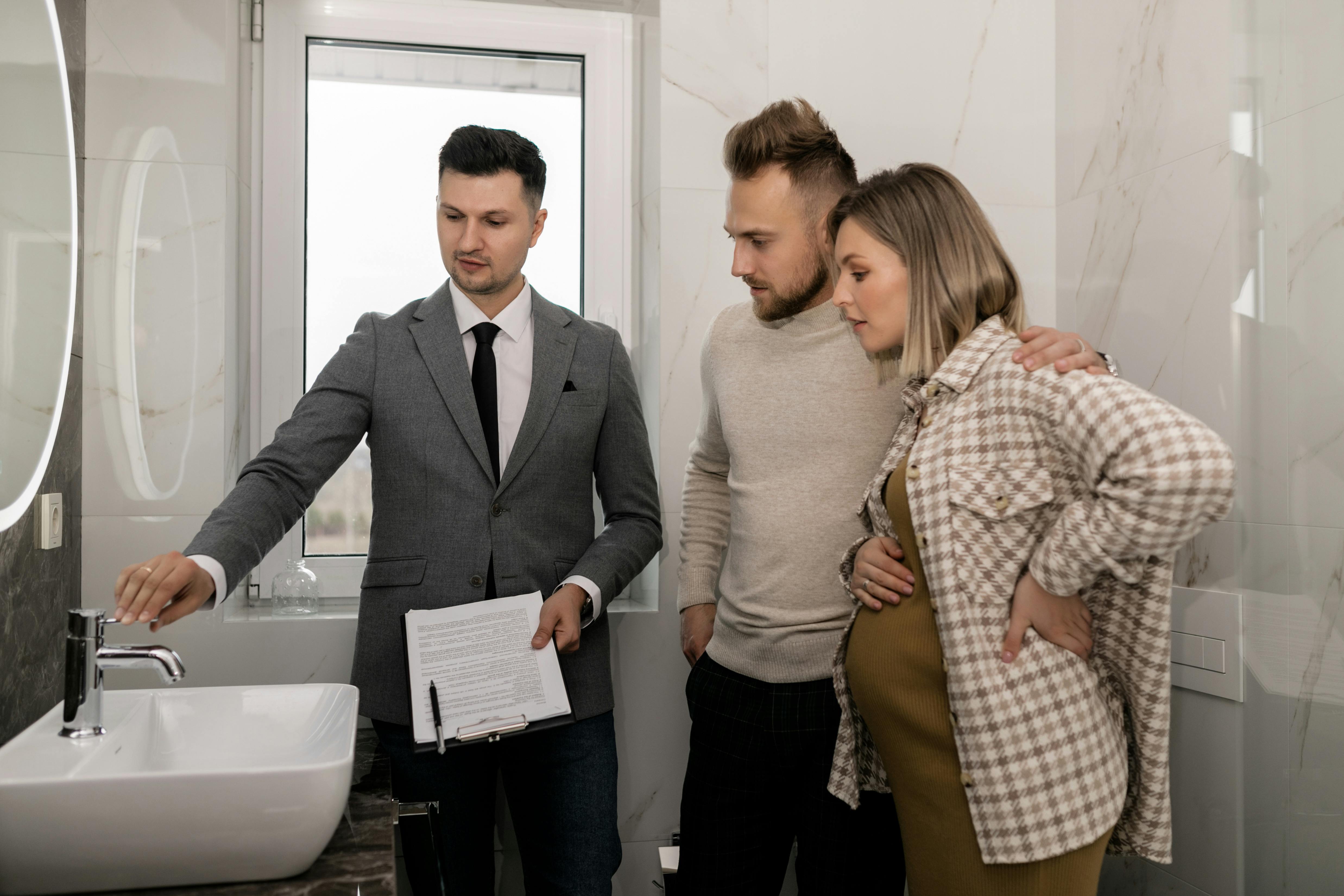 A Real Estate Showing the Comfort Room During a House Tour Visit