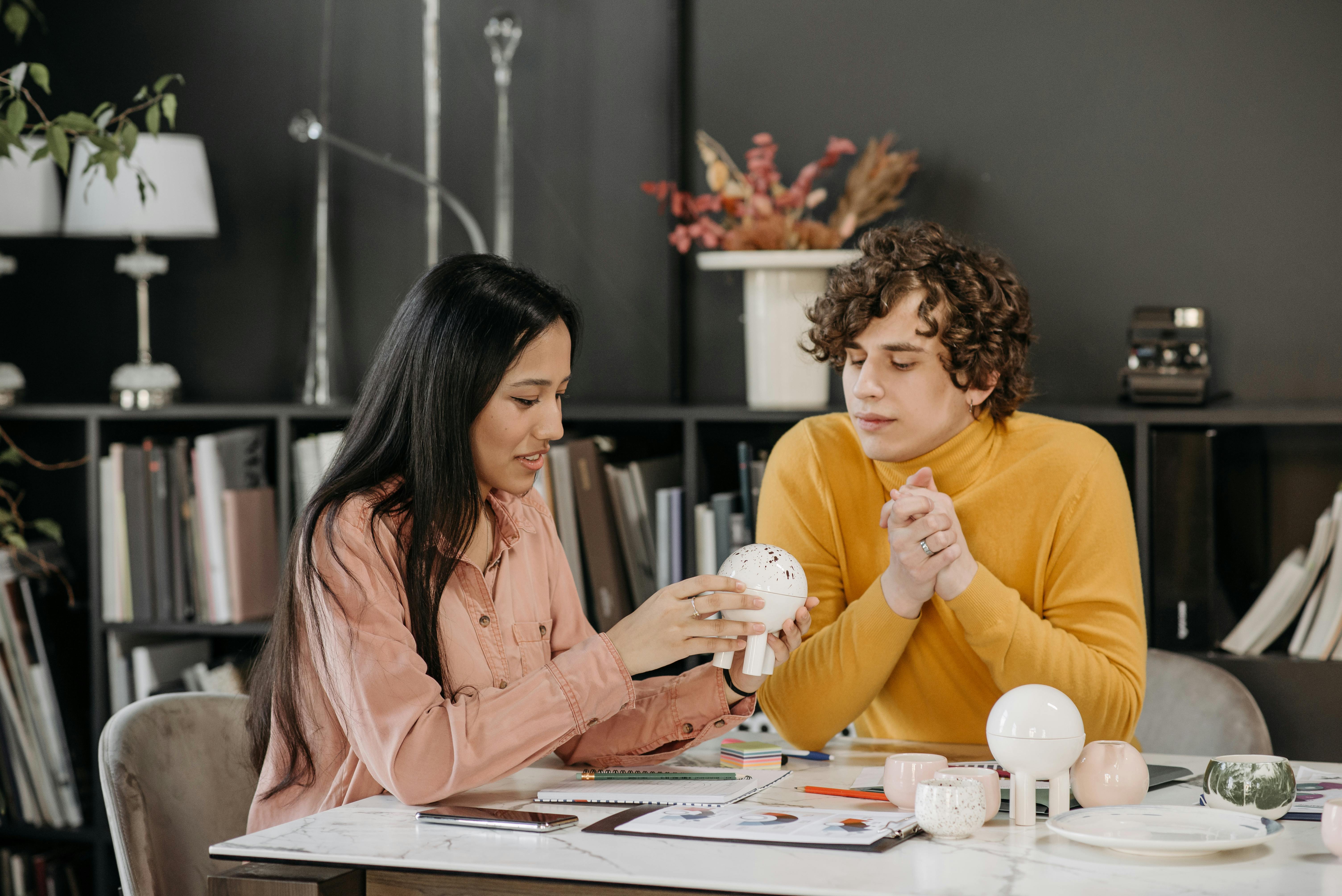 Man and Woman Sitting at the Table