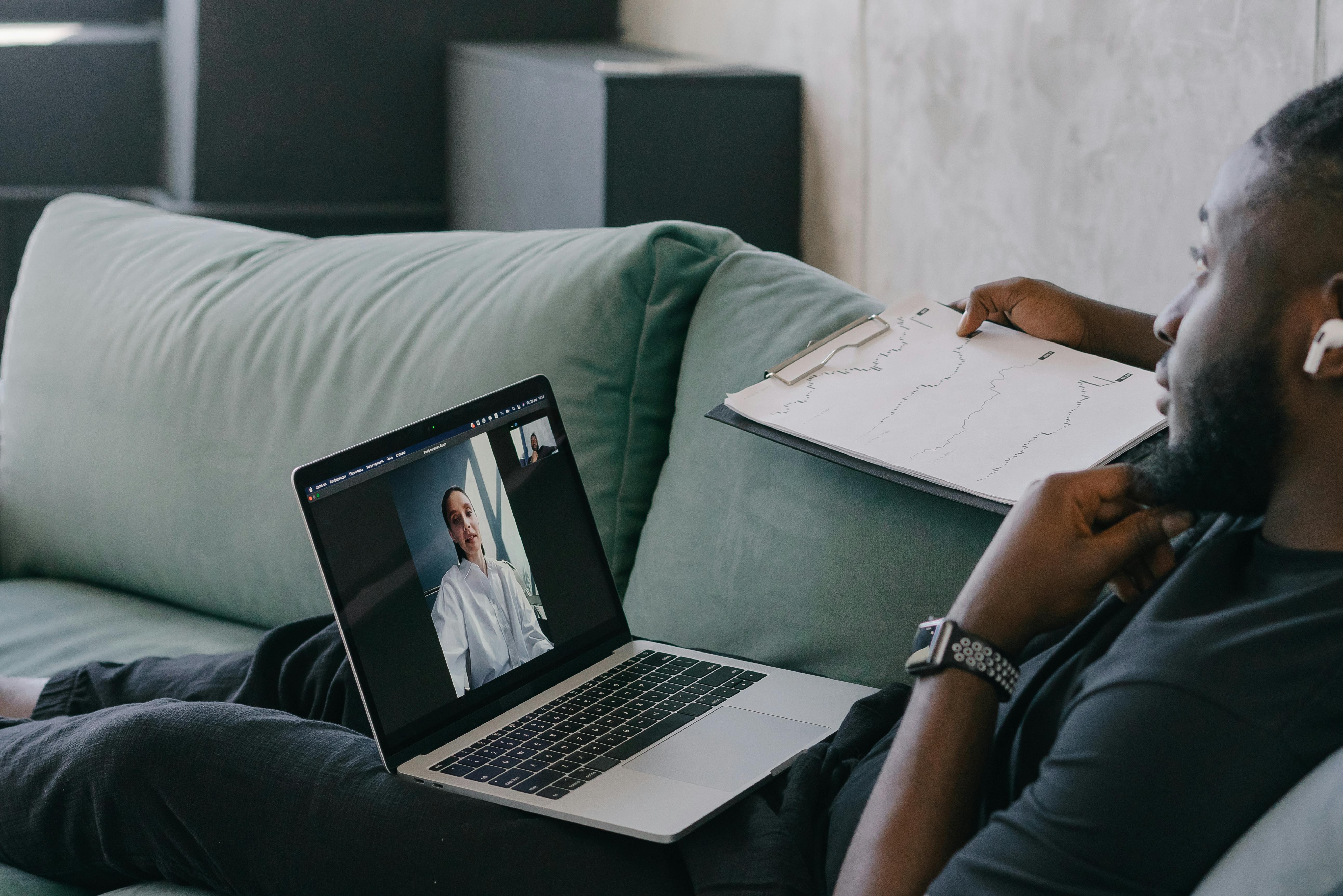 Person in Black Long Sleeve Shirt Using Macbook Pro