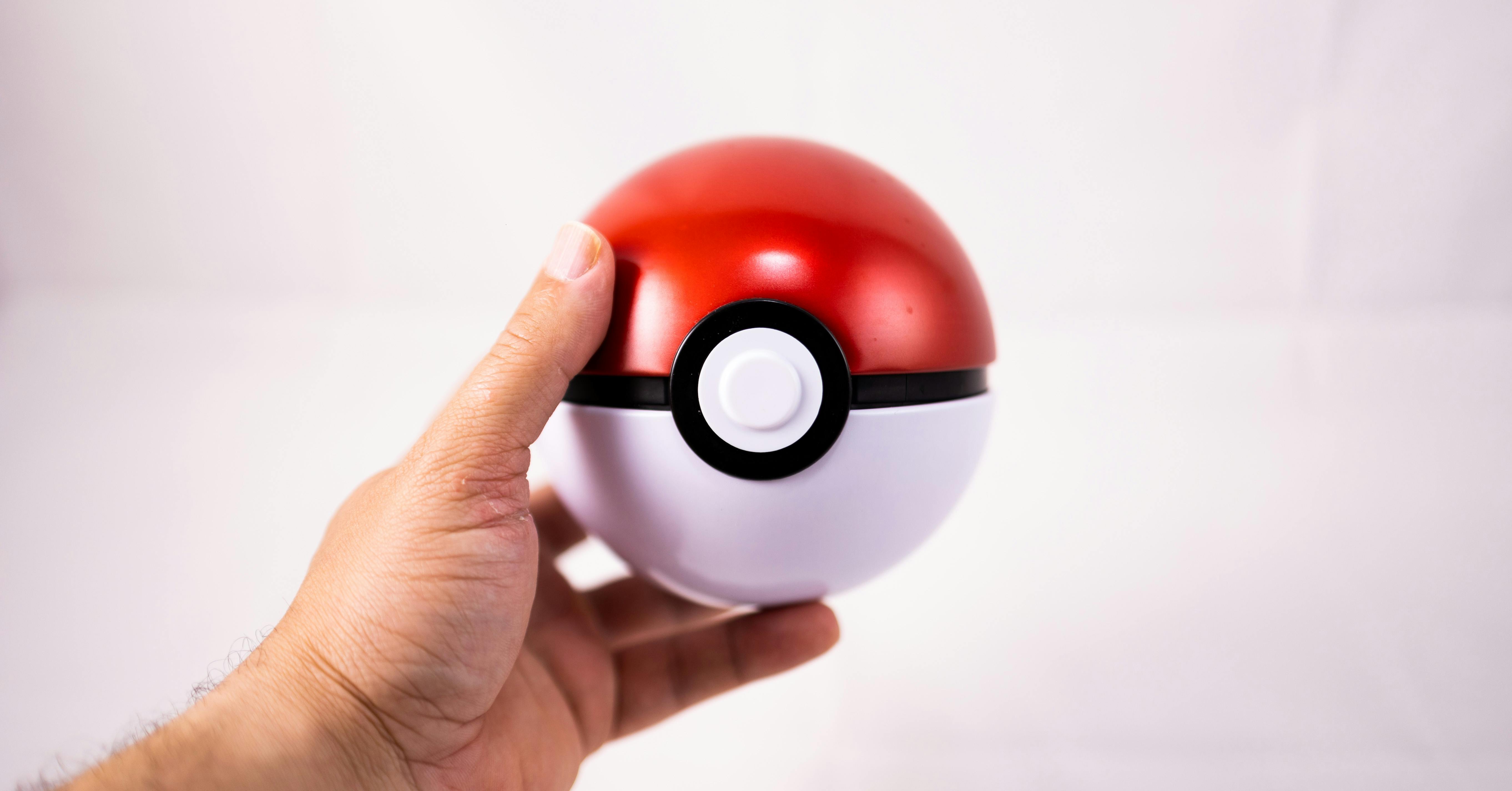 Hand Holding Pokeball Toy