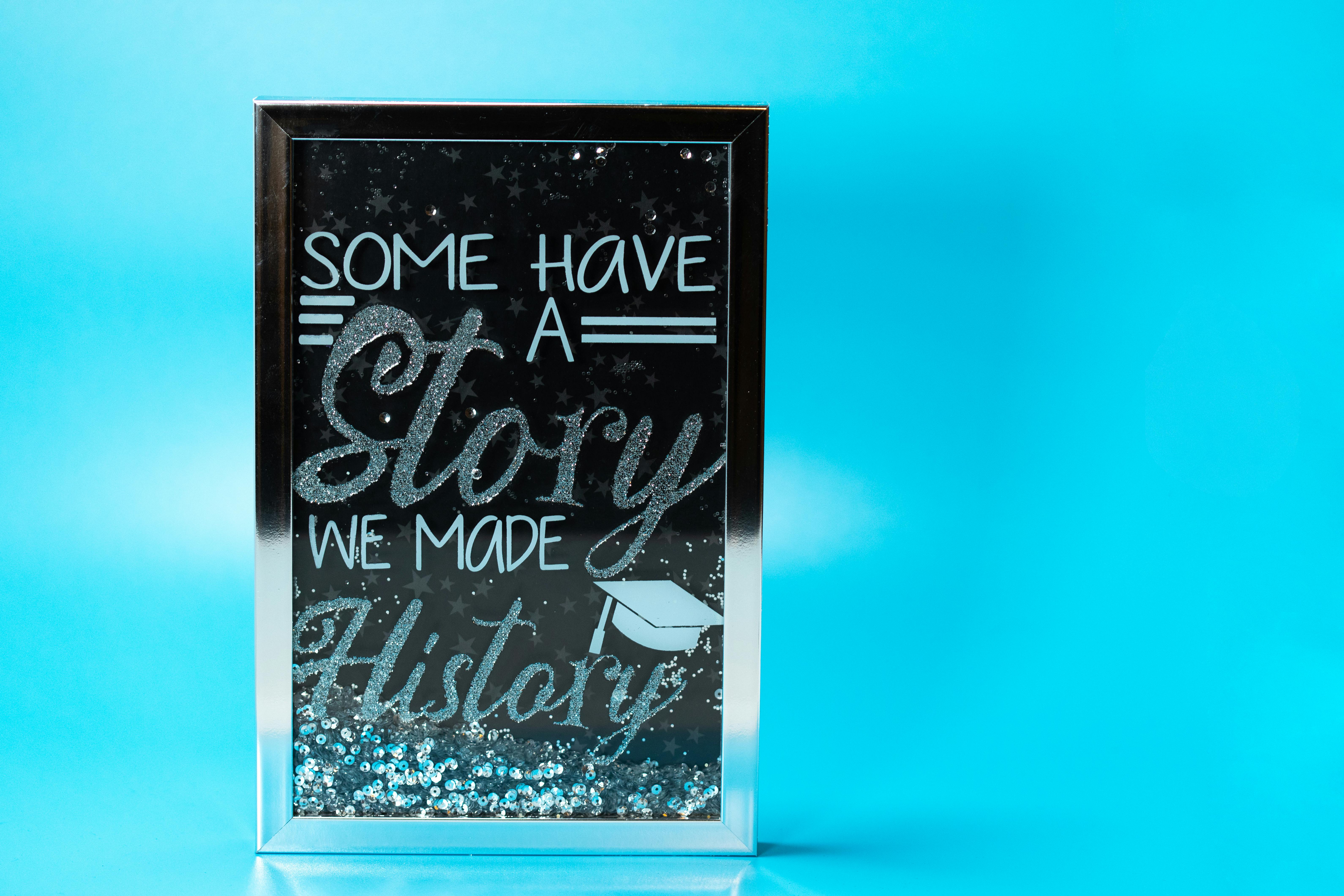 White and Black Text Sign on Blue Background