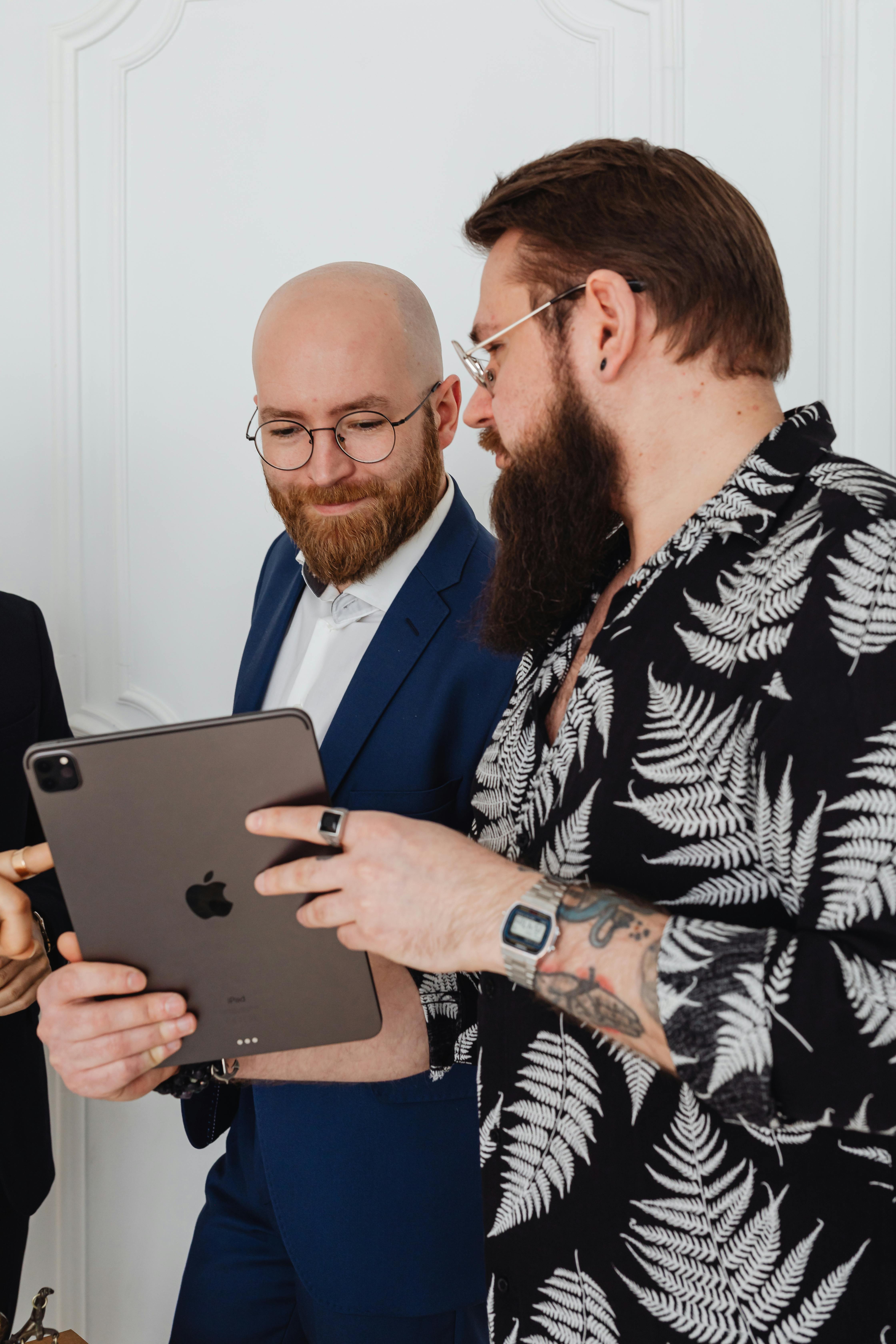 A Businessman Showing a Tablet to an Associate