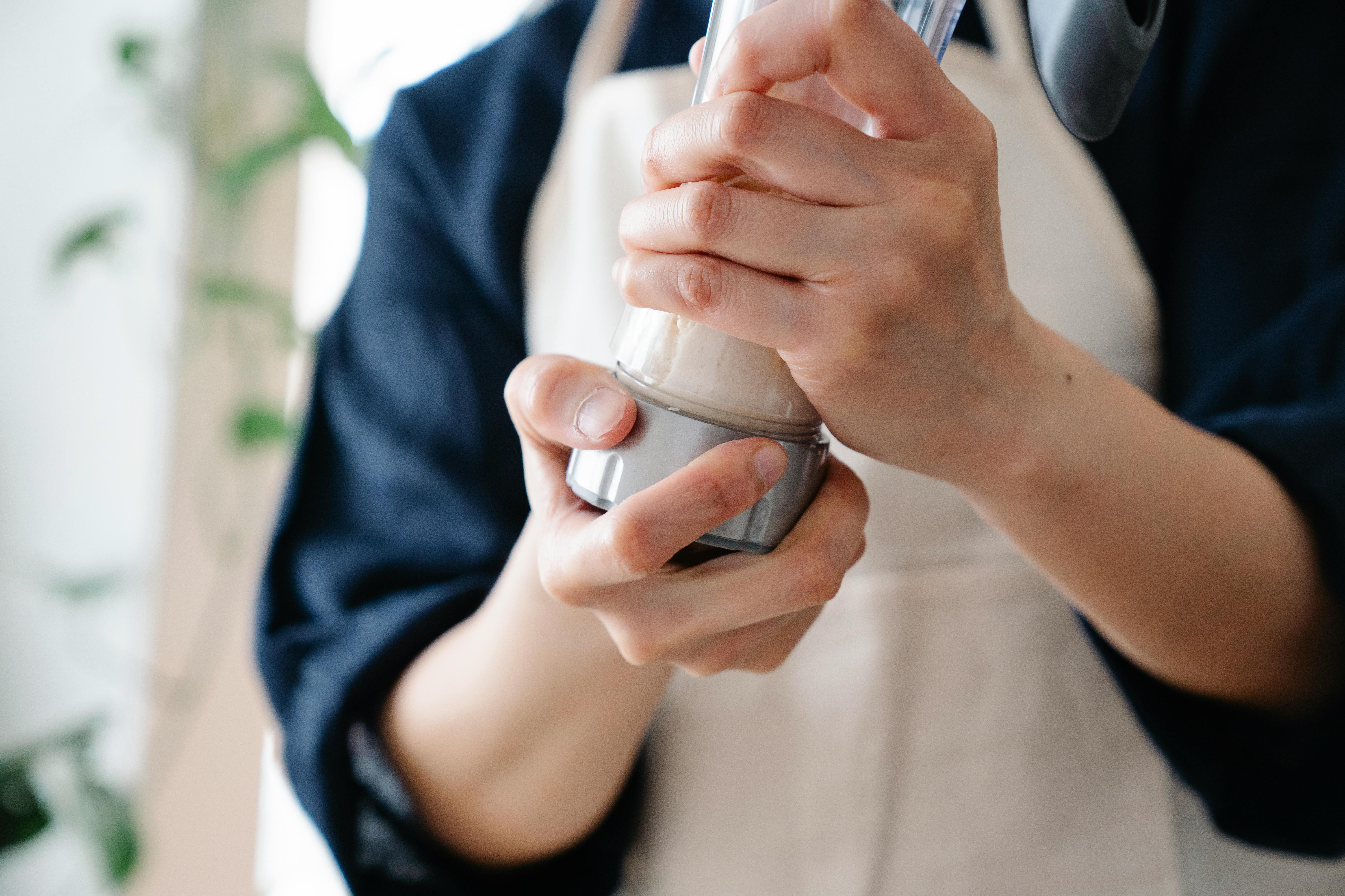 A Person Holding a Shaker Container