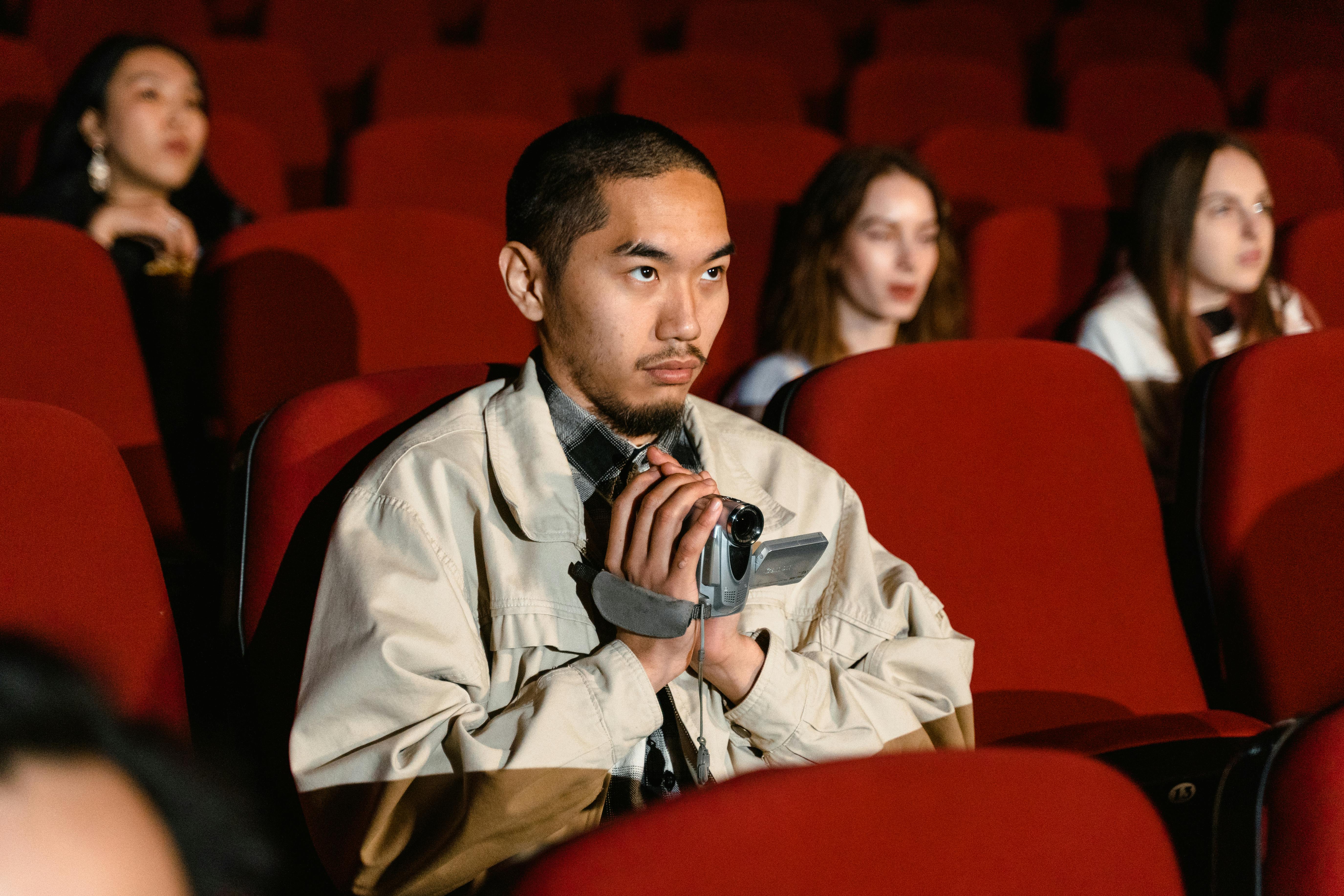 A Man Recording at the Cinema