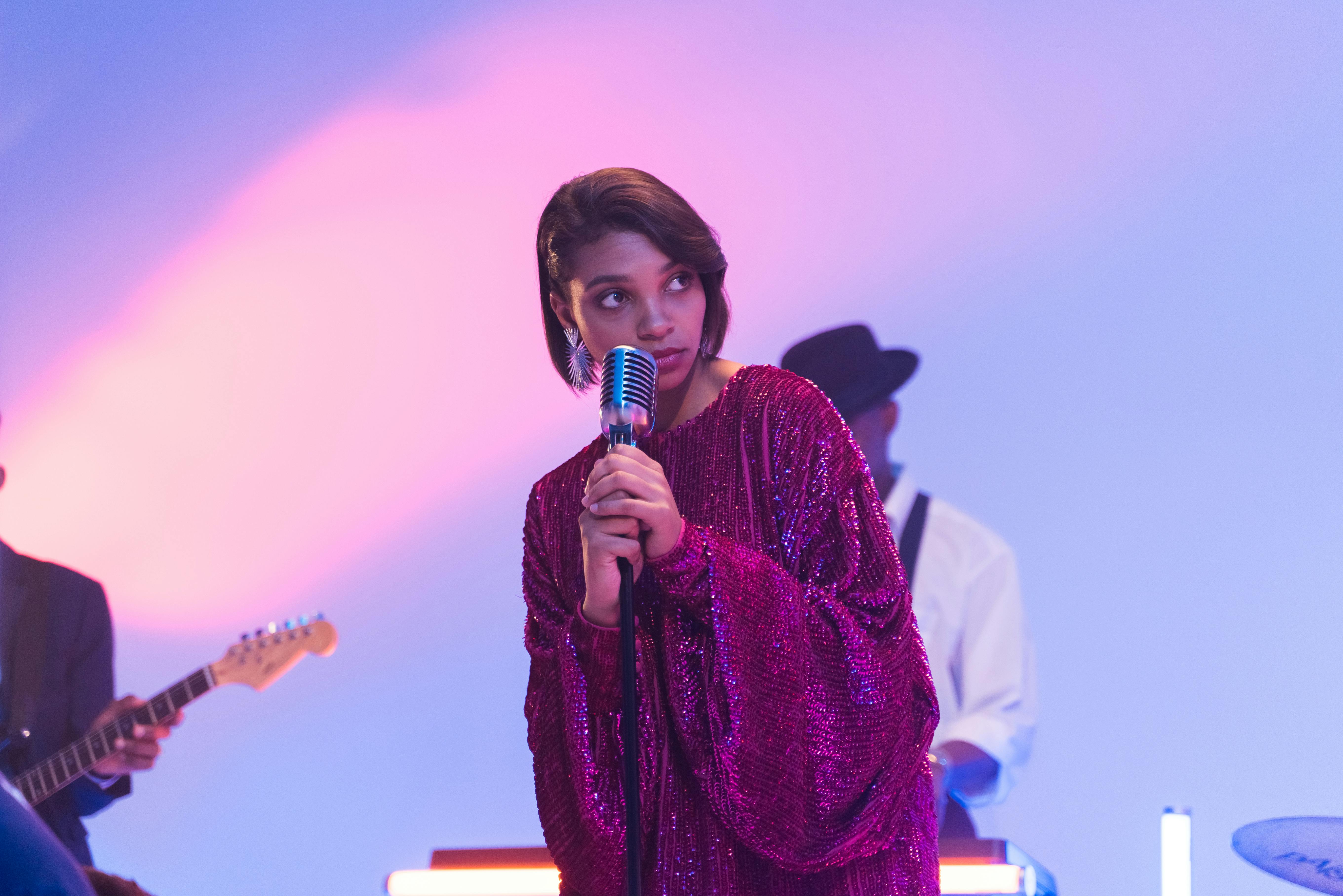 A woman expressing herself while singing