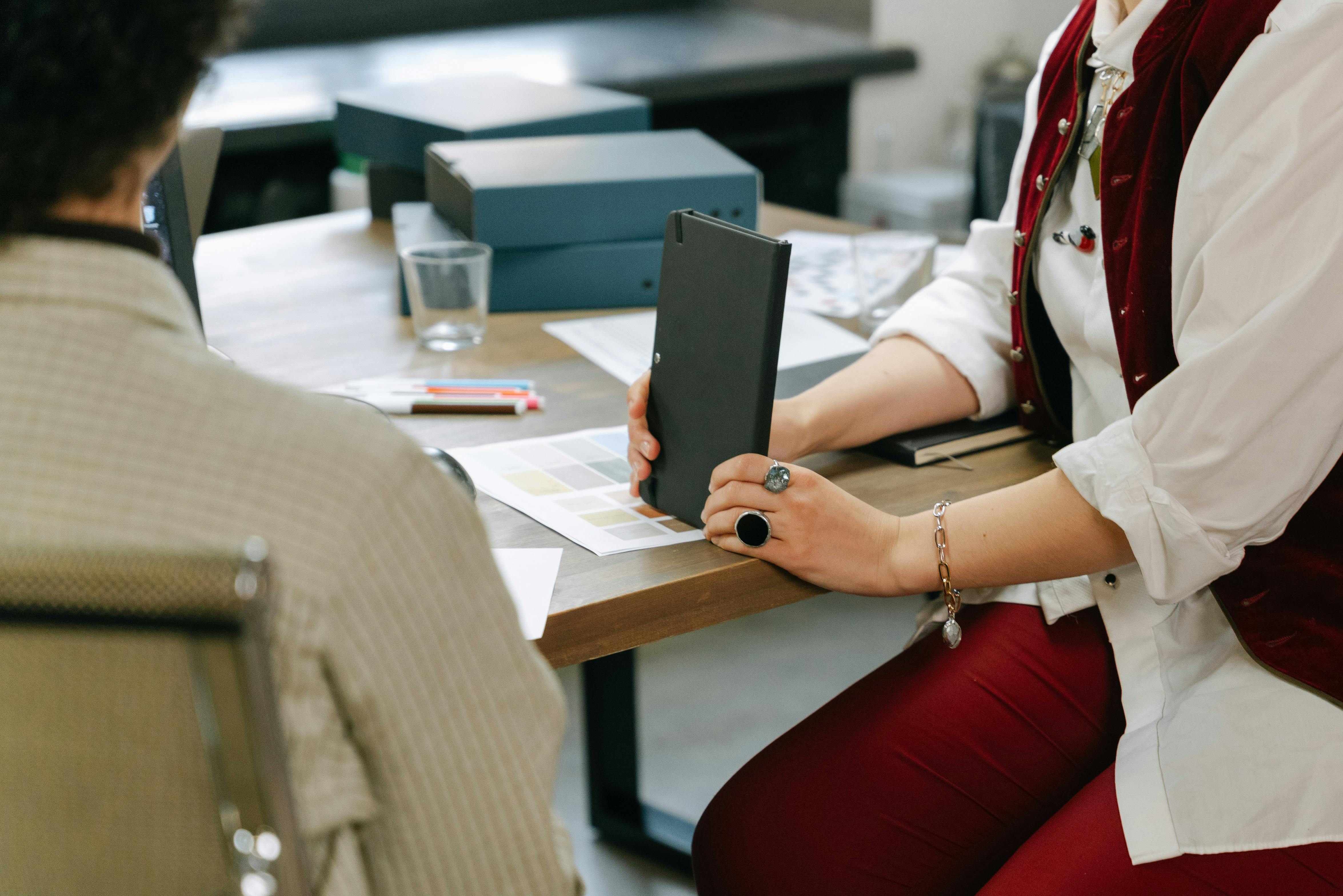 An Employee Holding a Notebook