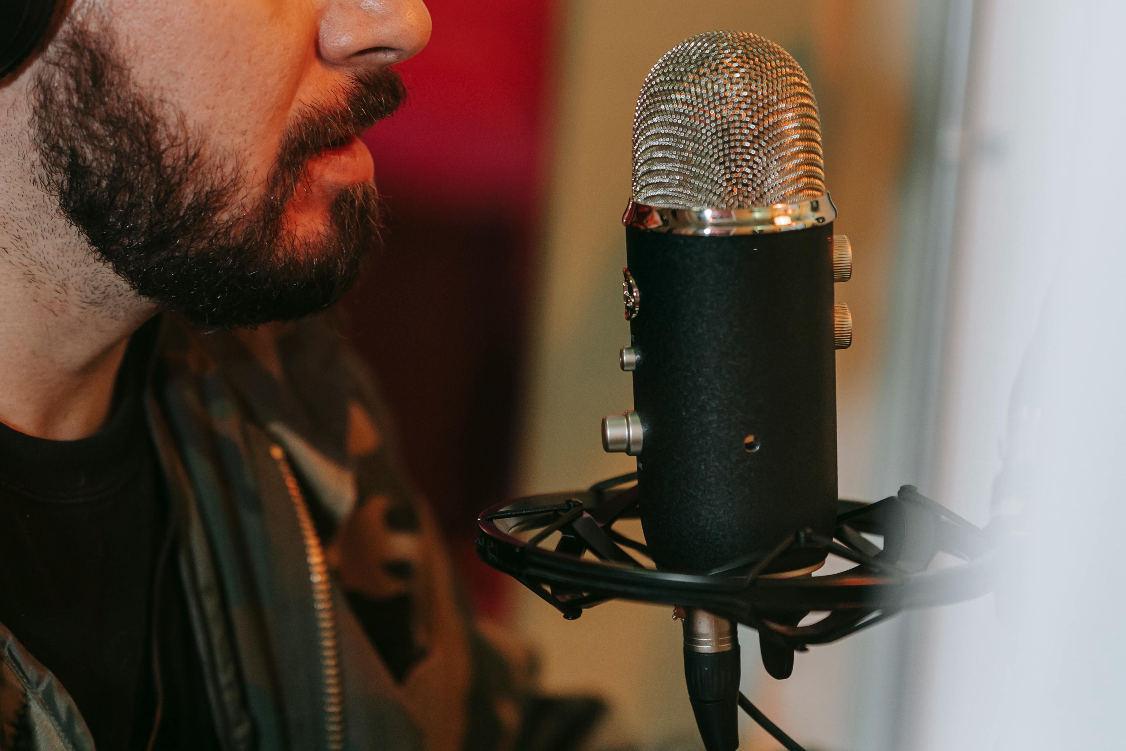 A Man Singing in Front of the Microphone