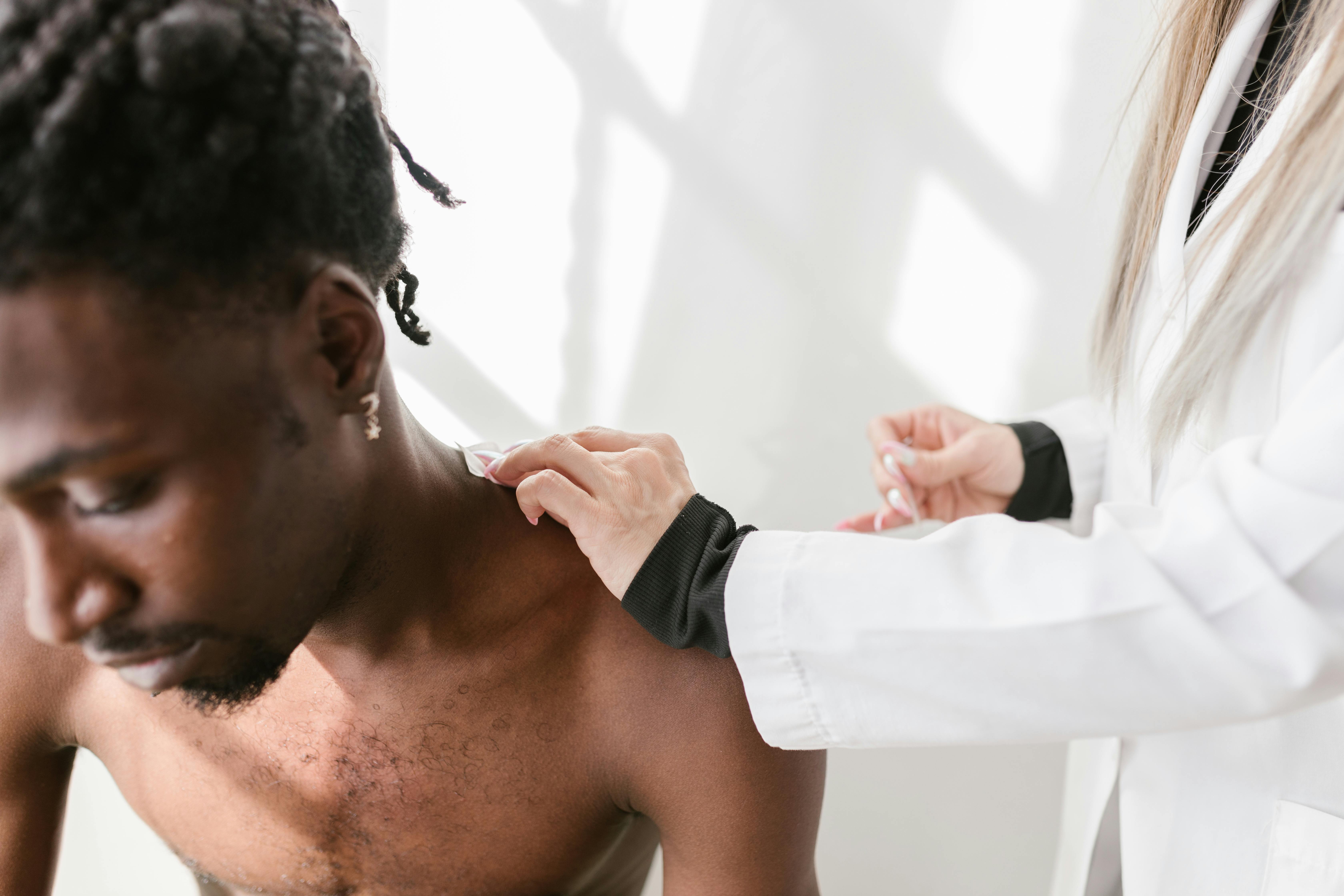 A Person Touching a Man Shoulder