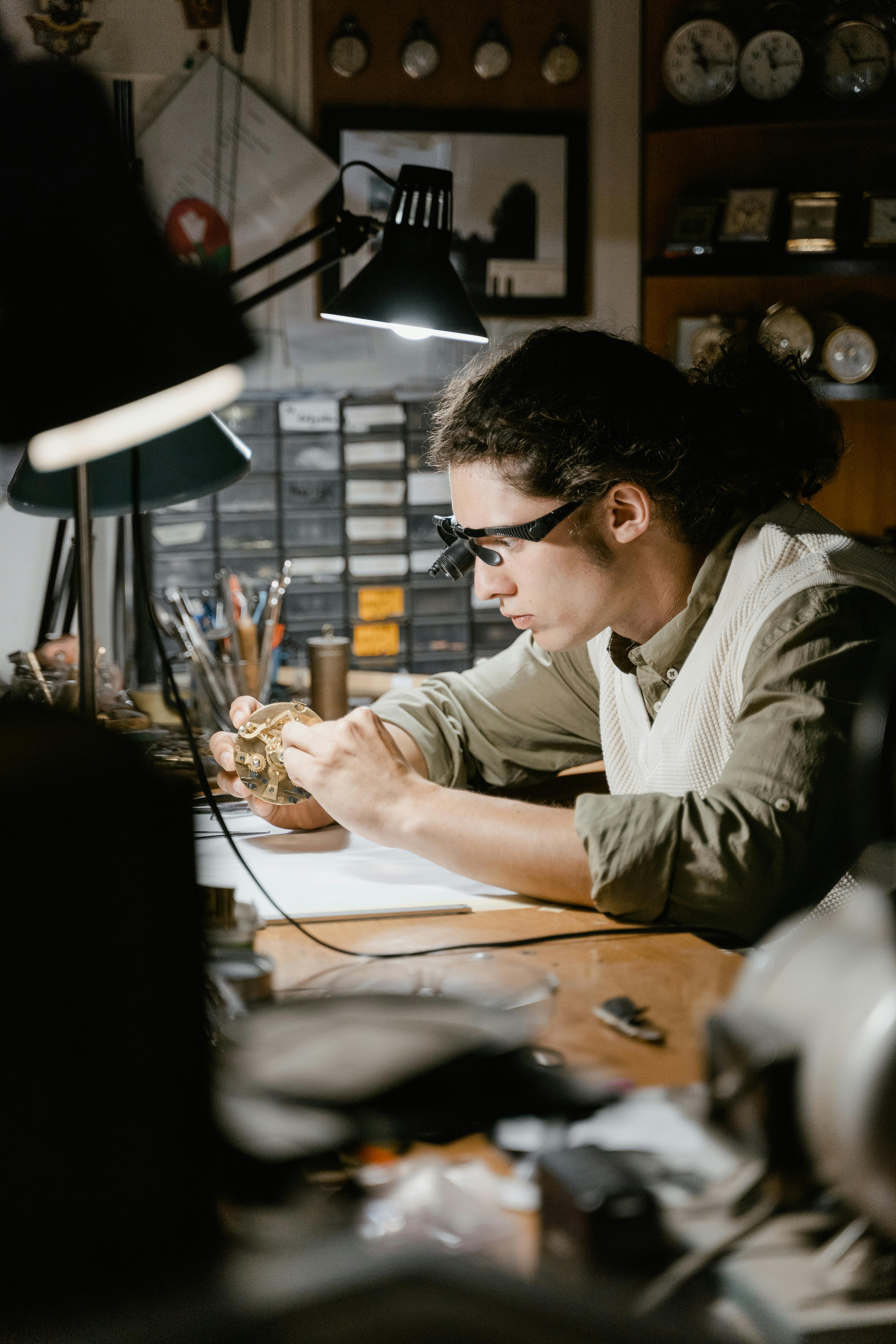 Watchmaker Repairing a Watch in his Repair Shop 