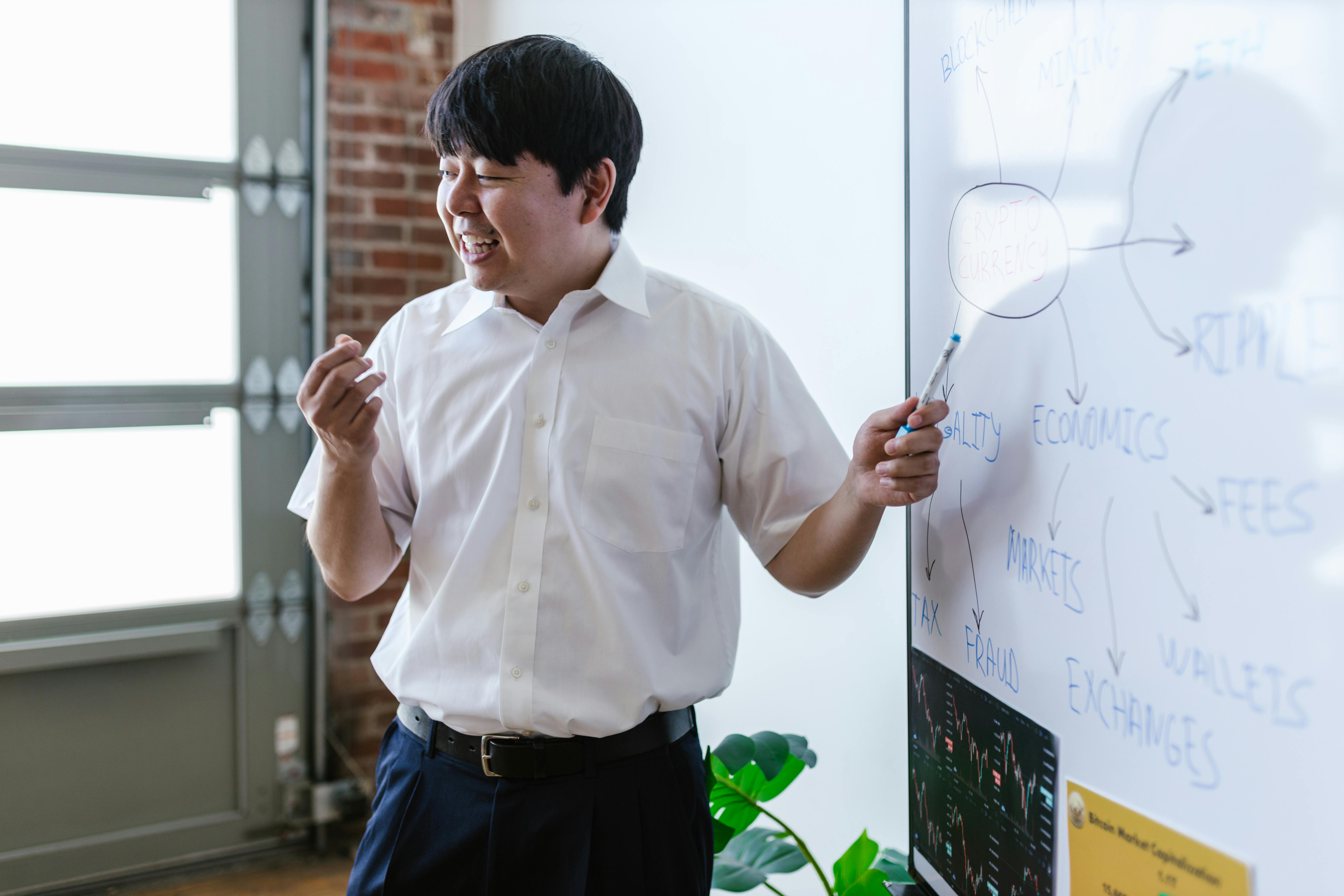 A Man in White Polo Shirt Smiling while Discussing