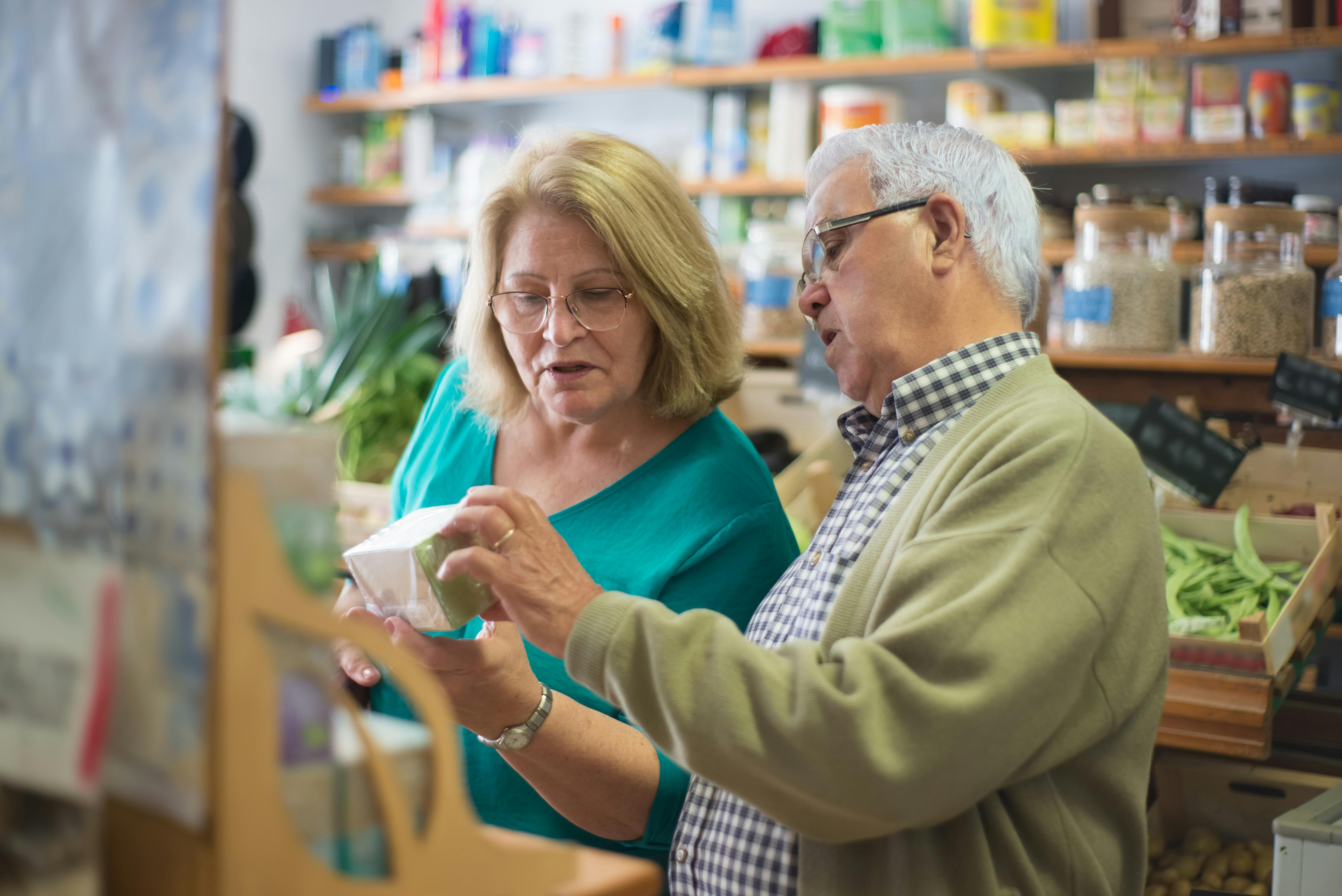 Elderly Couple looking at a Product