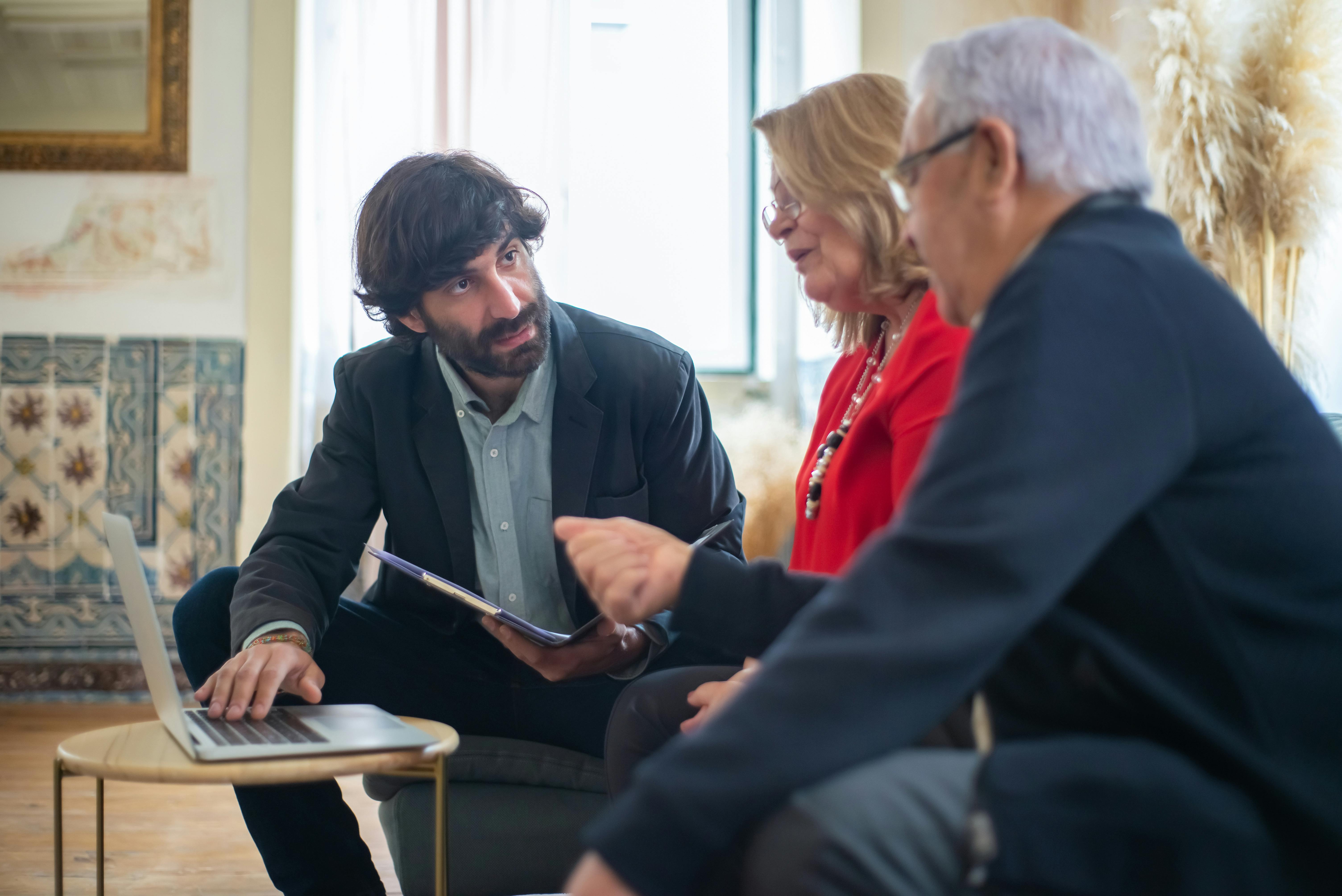 Two People Discussing Over documents