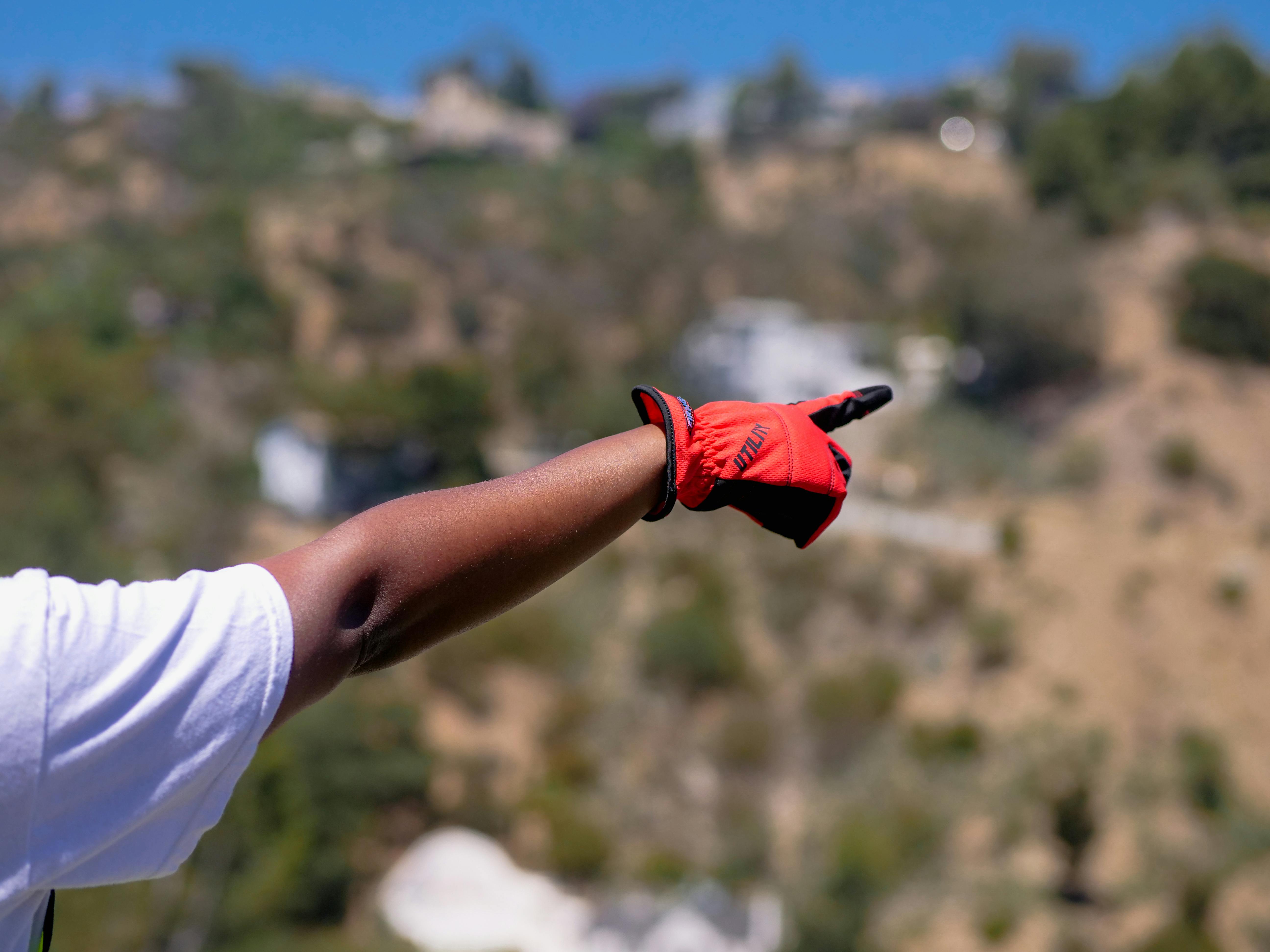 Person Wearing Red Protective Gloves