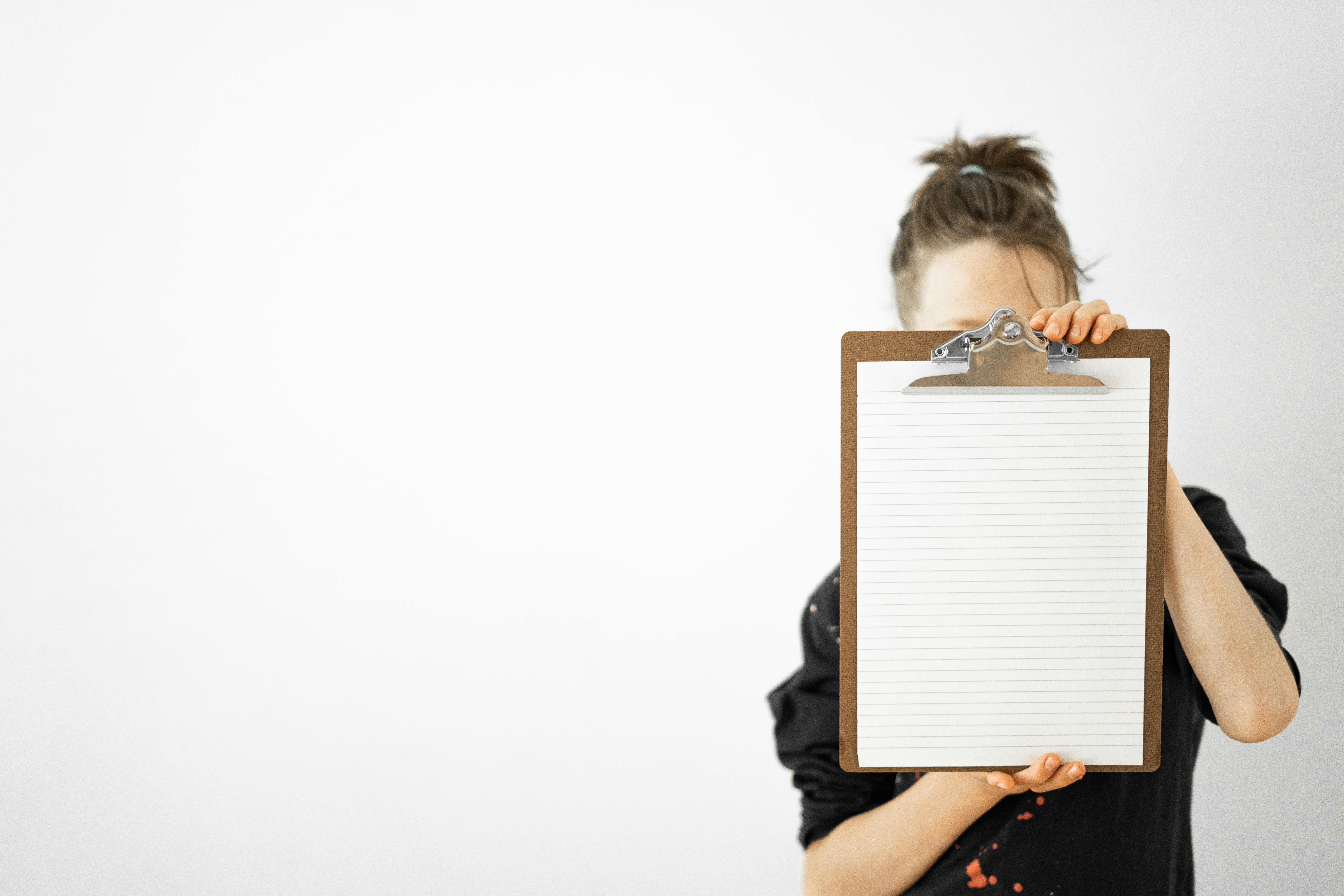 Woman Holding Clipboard