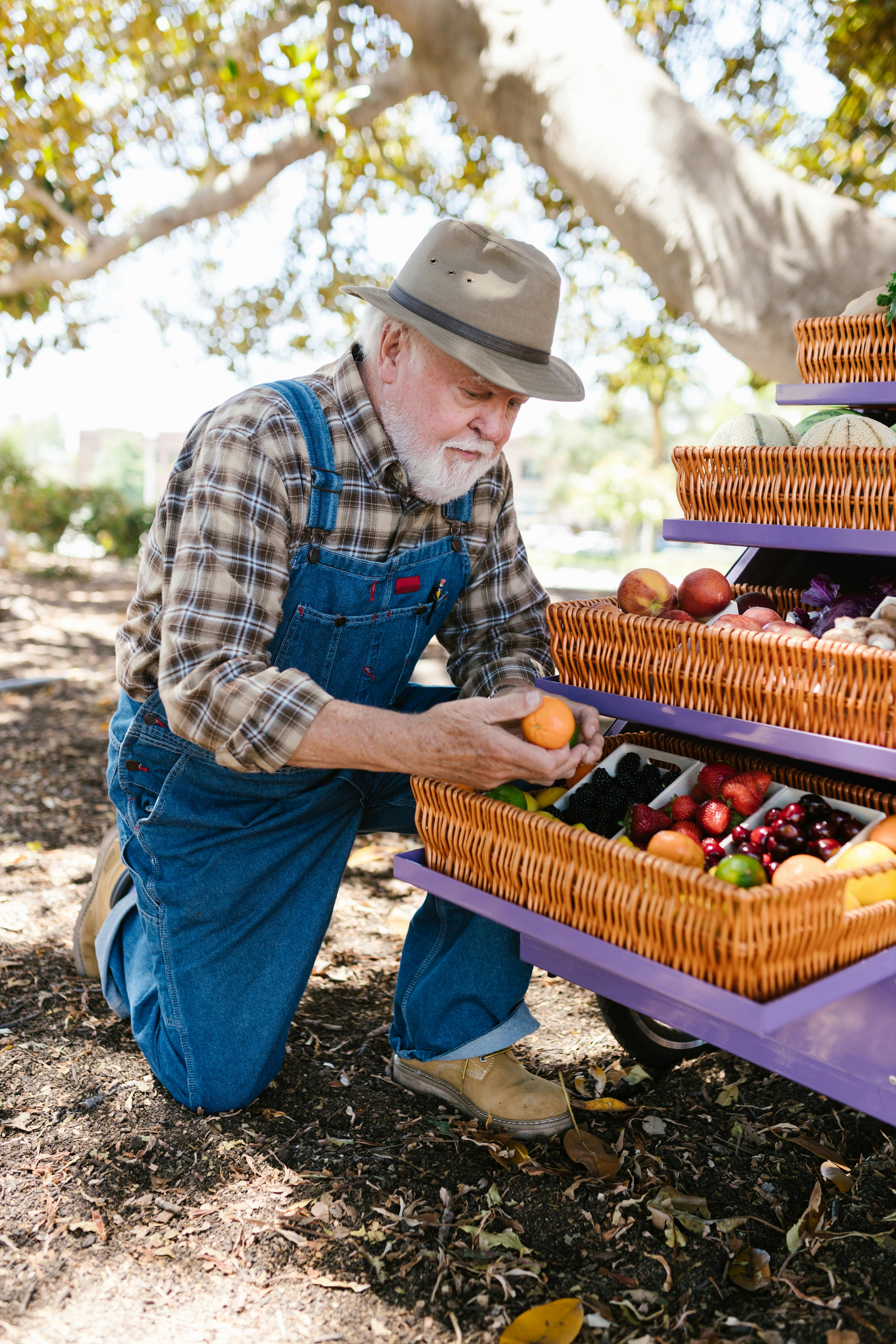 Elderly Man Wearing a Plaid Shirt and Overalls