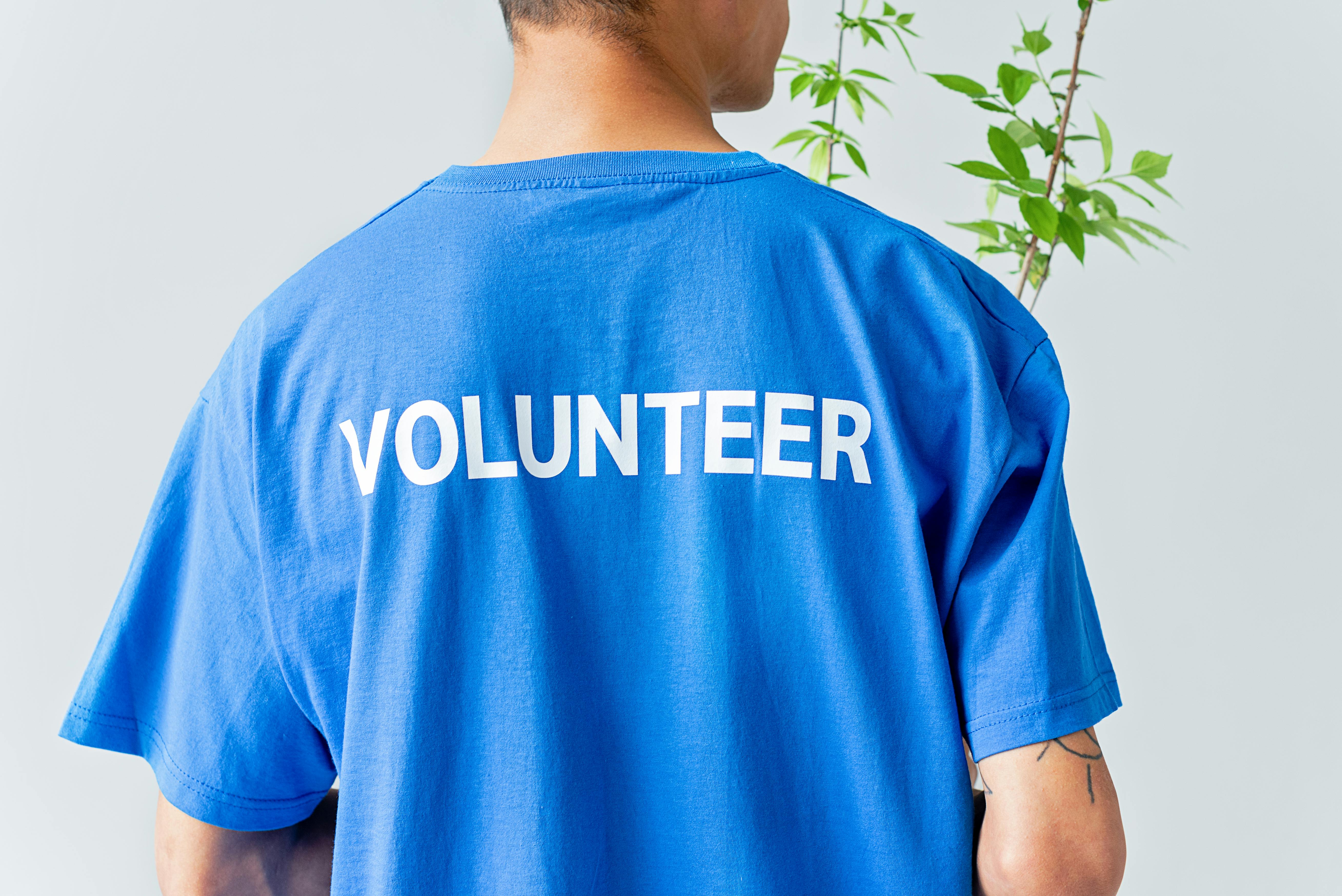 Close-up Photo of Man in Blue Shirt