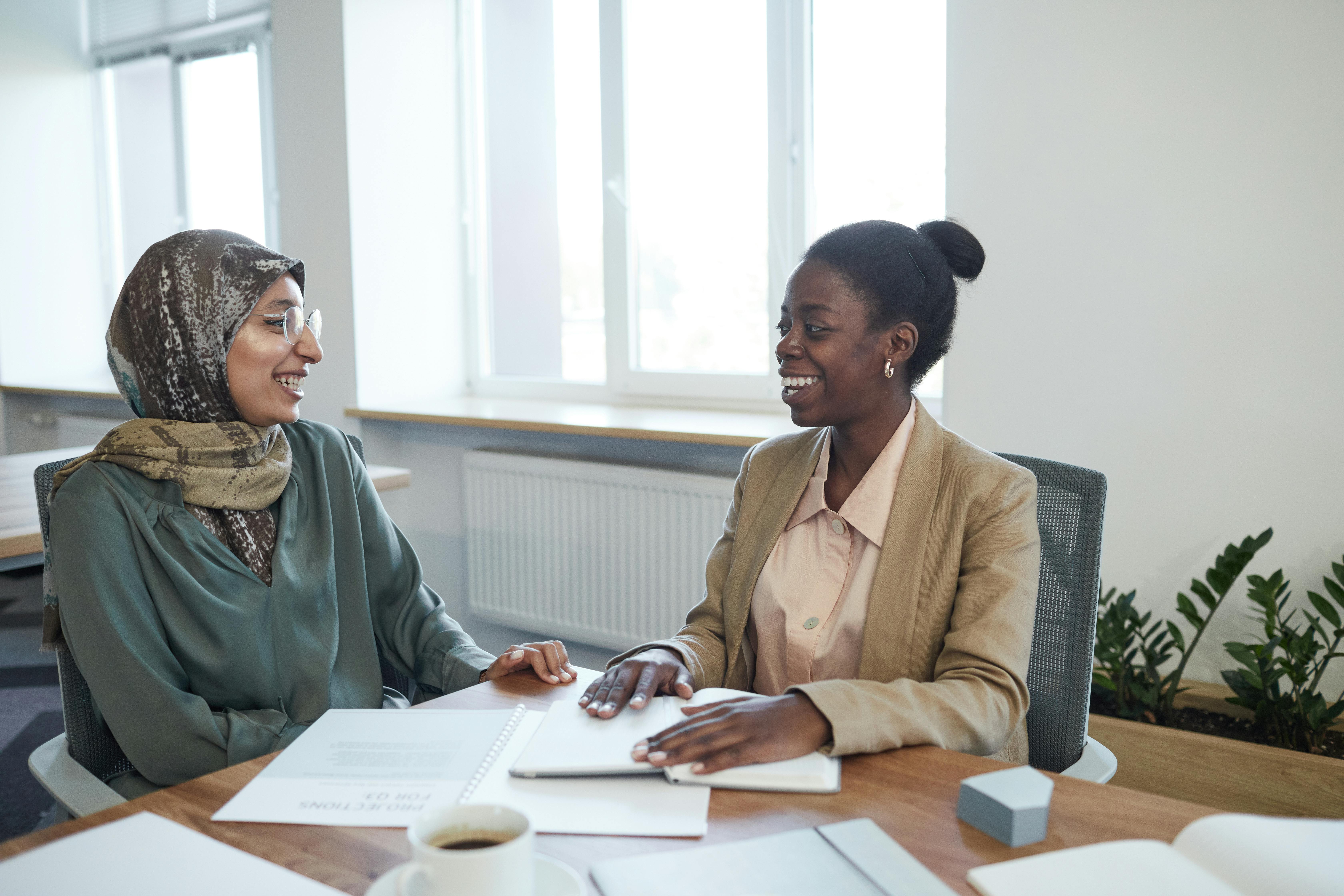 Smiling Women Having a Conversation