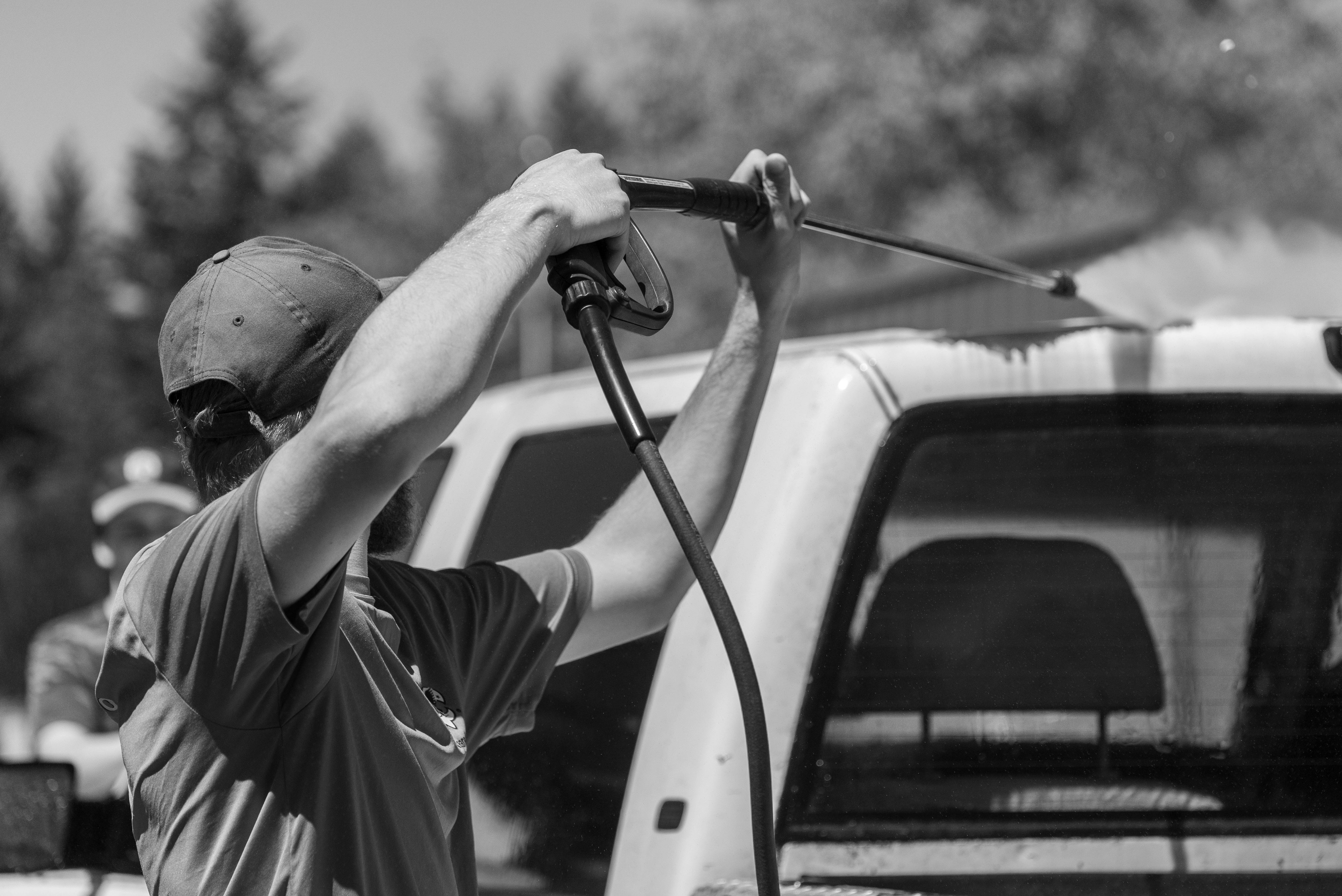 A Man Holding a Power Spray