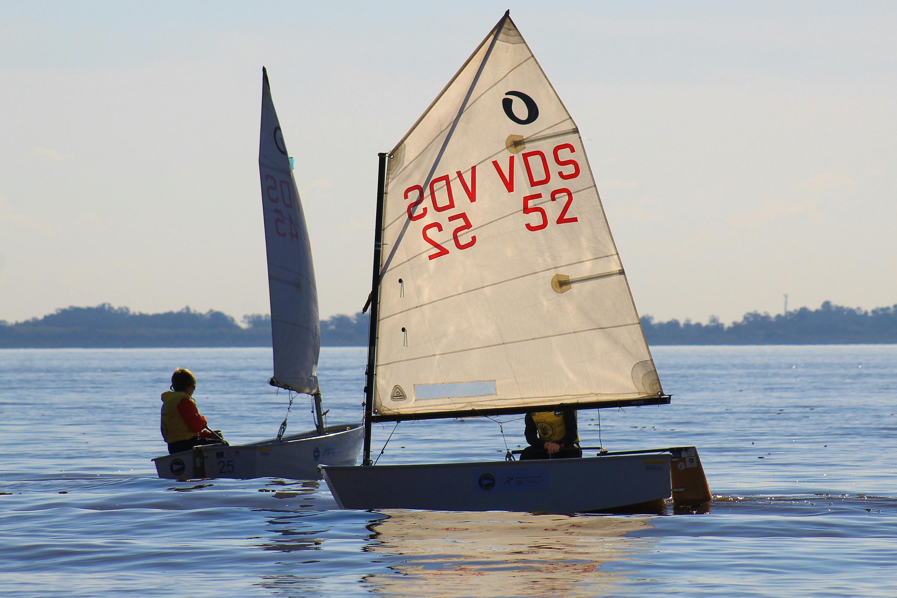 Photograph of a Men Sailing on a Sea