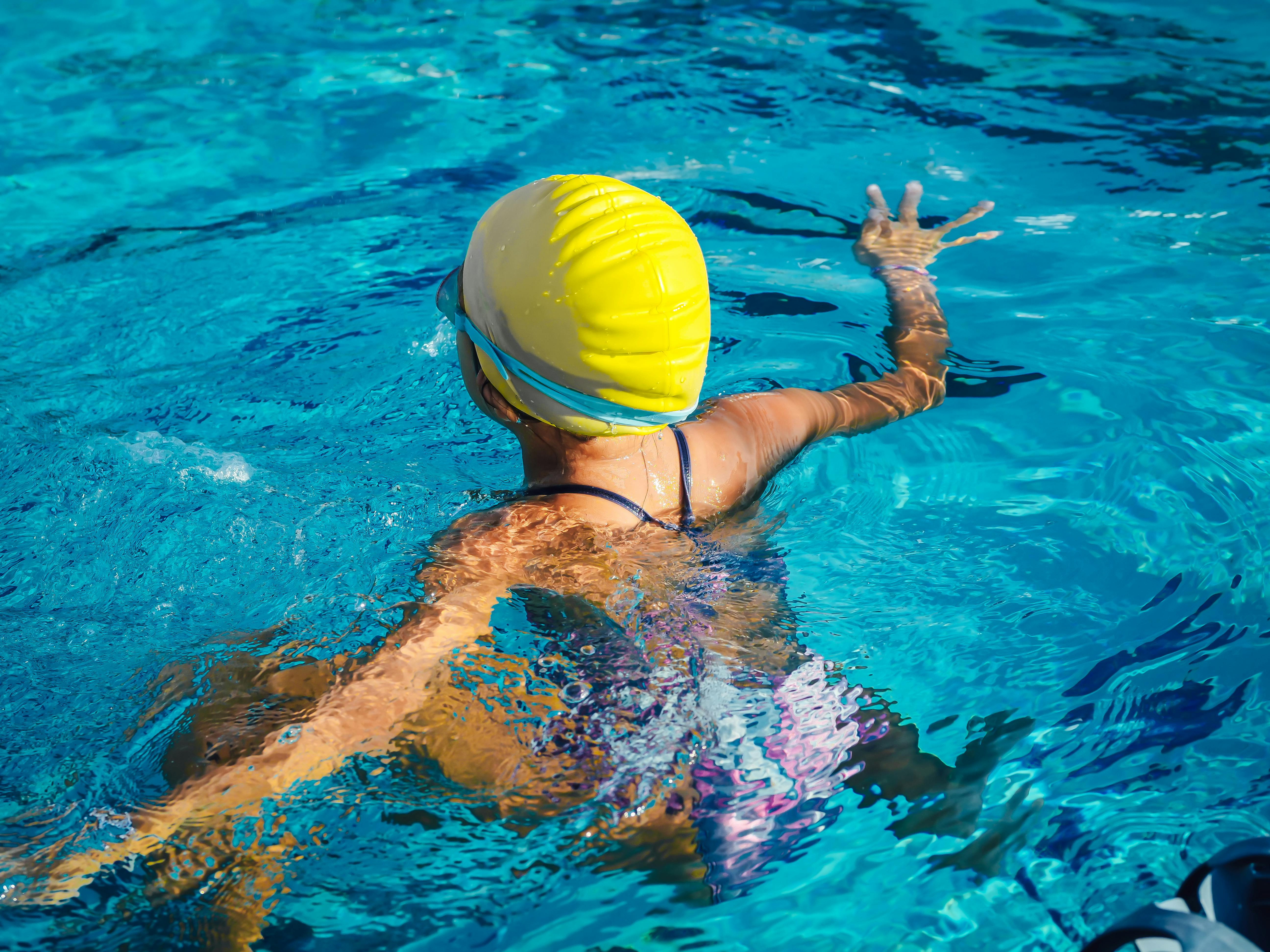 Back View of a Swimmer in a Pool