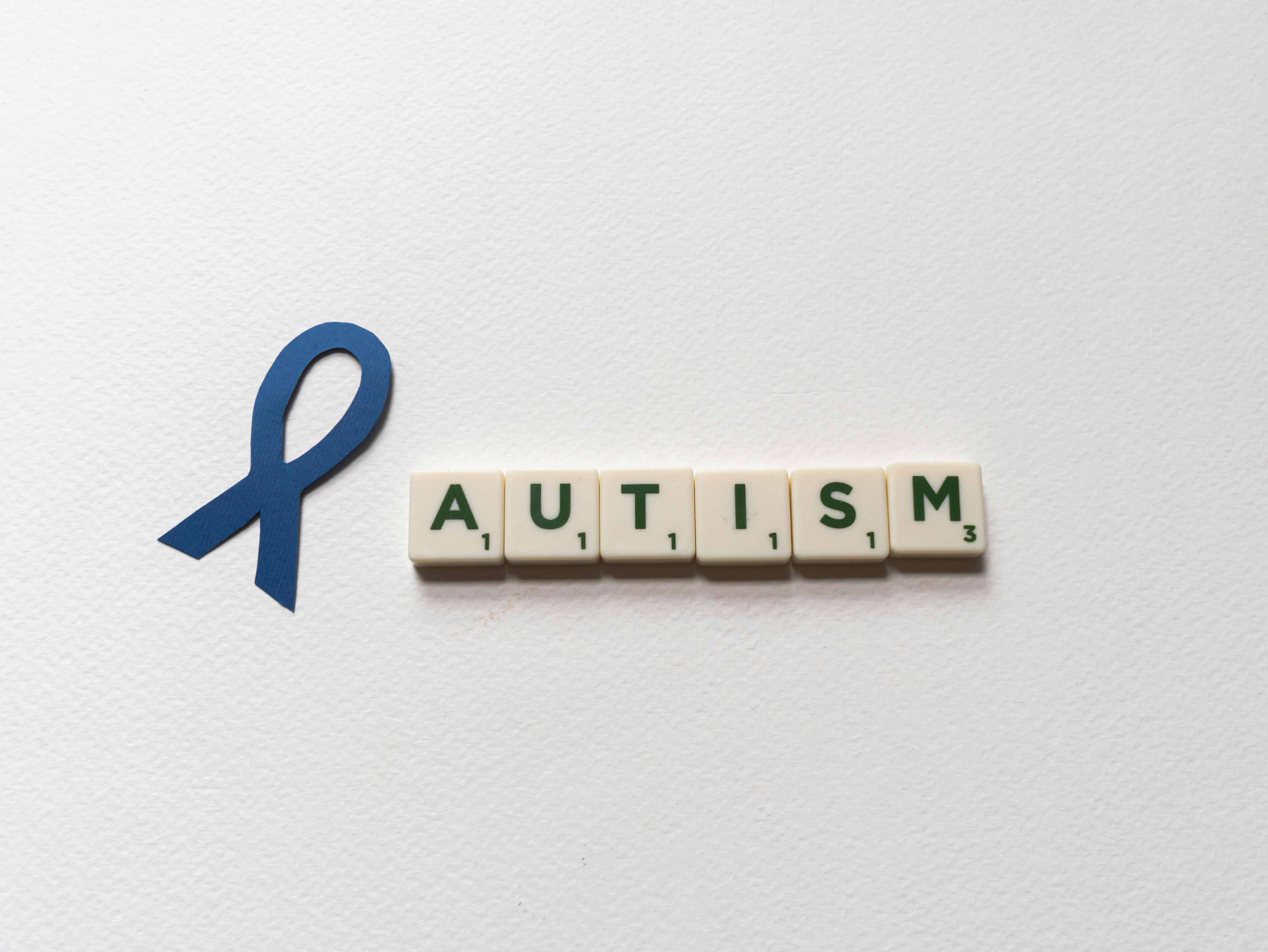 Letter Tiles beside a Blue Ribbon Cutout