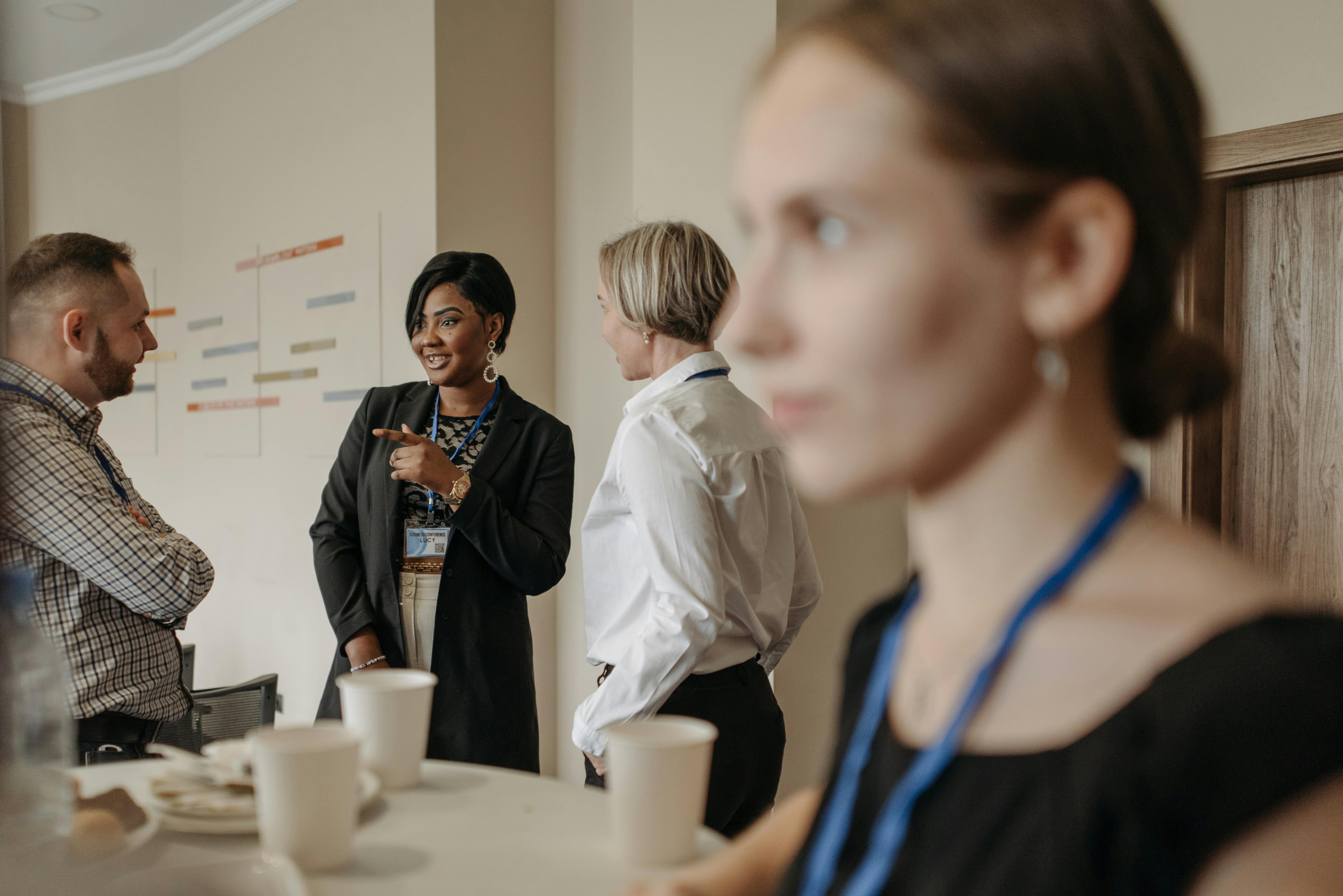 Group of People Having a Discussion in an Office