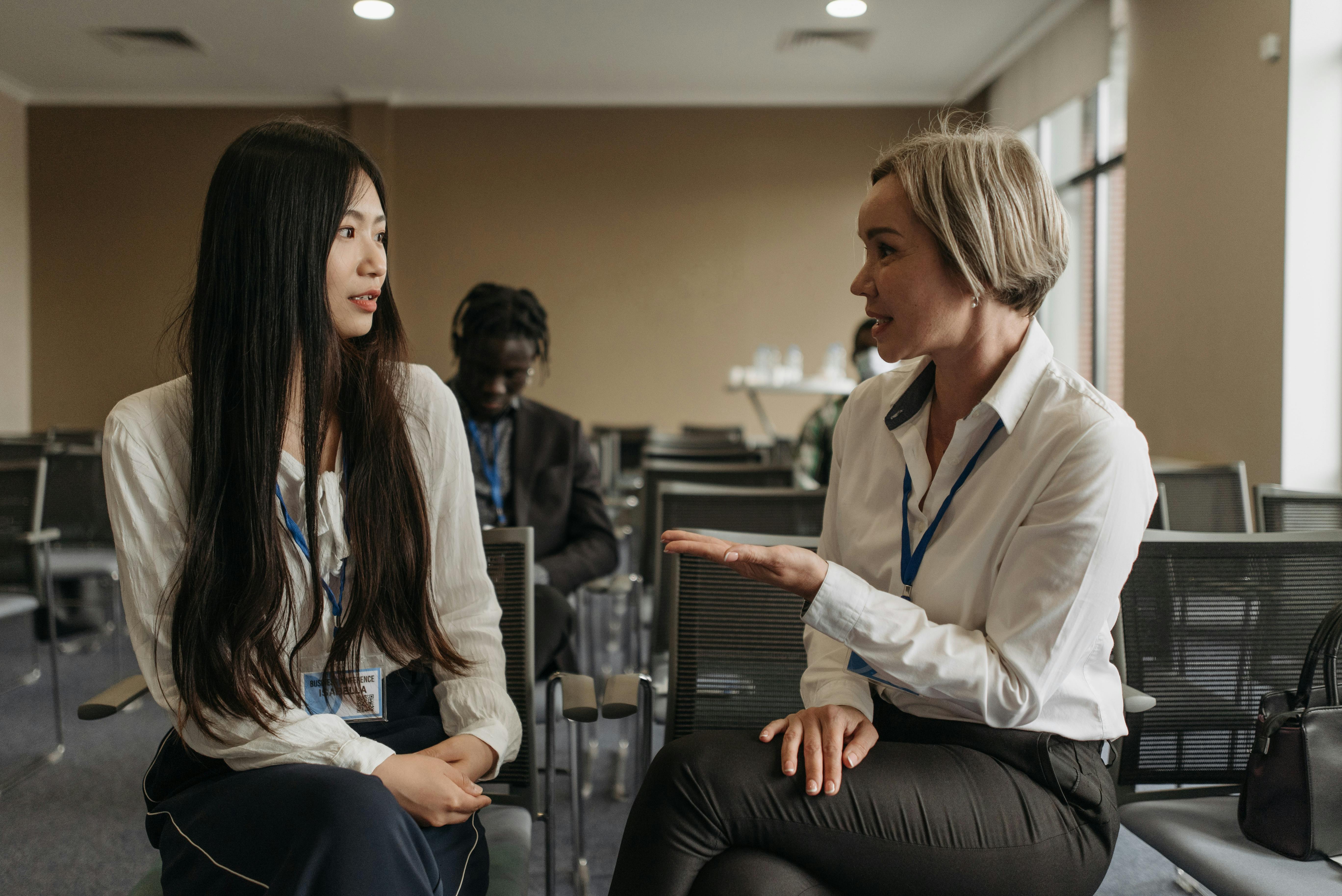 Two Women Talking in the Office